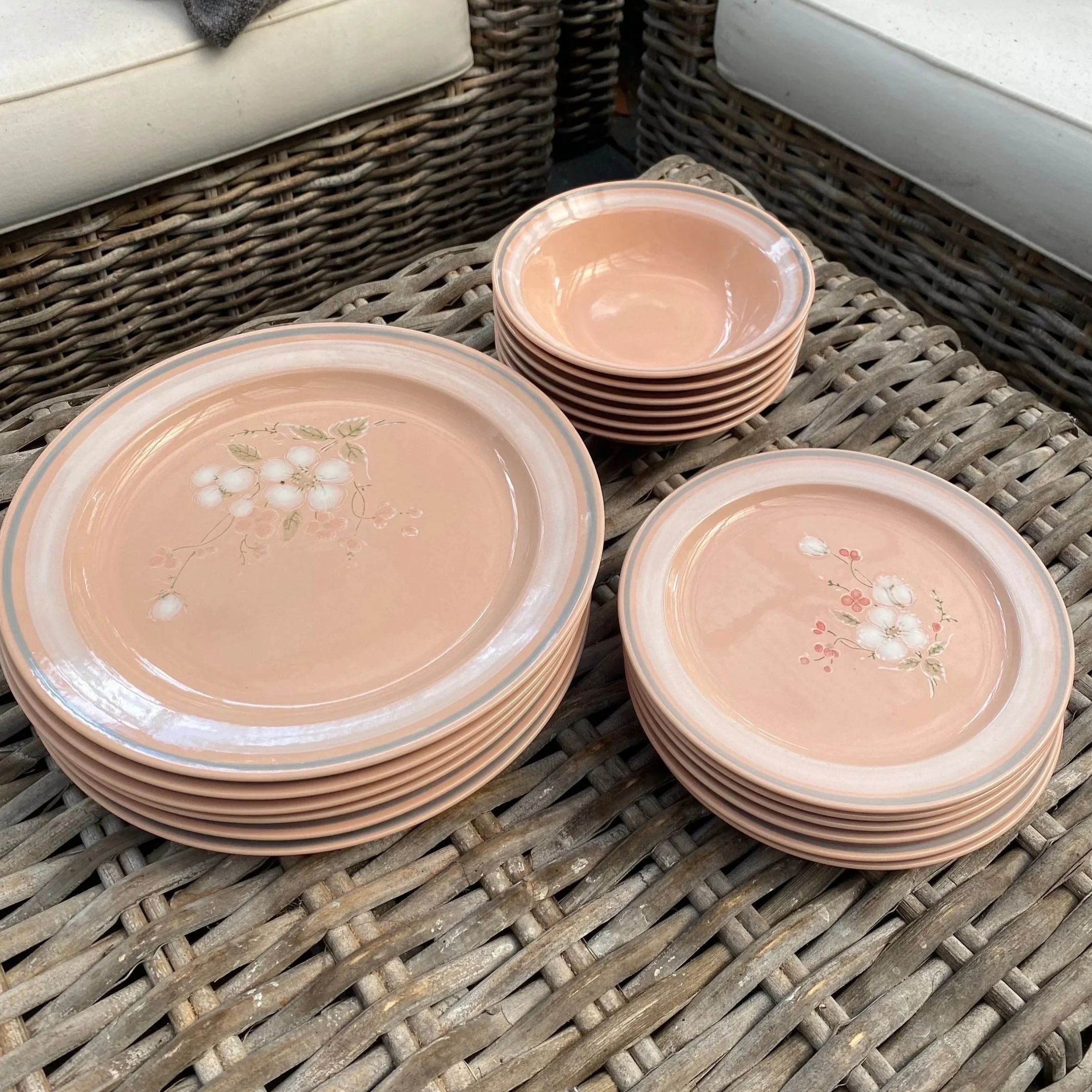 Full 18-piece Essentials set stacked neatly on wicker chair