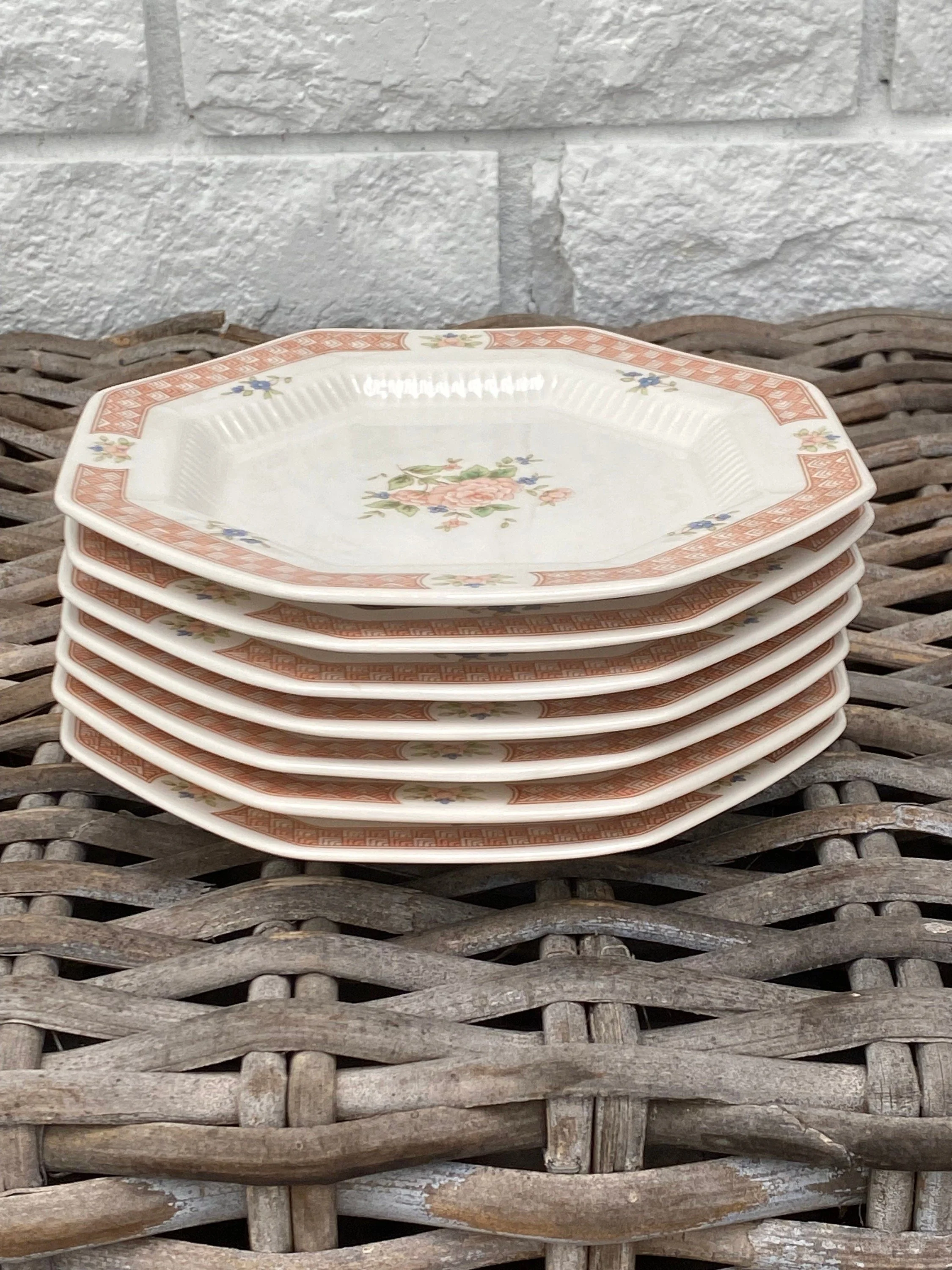 Stack of dinner plates – top view of floral centre and octagonal design