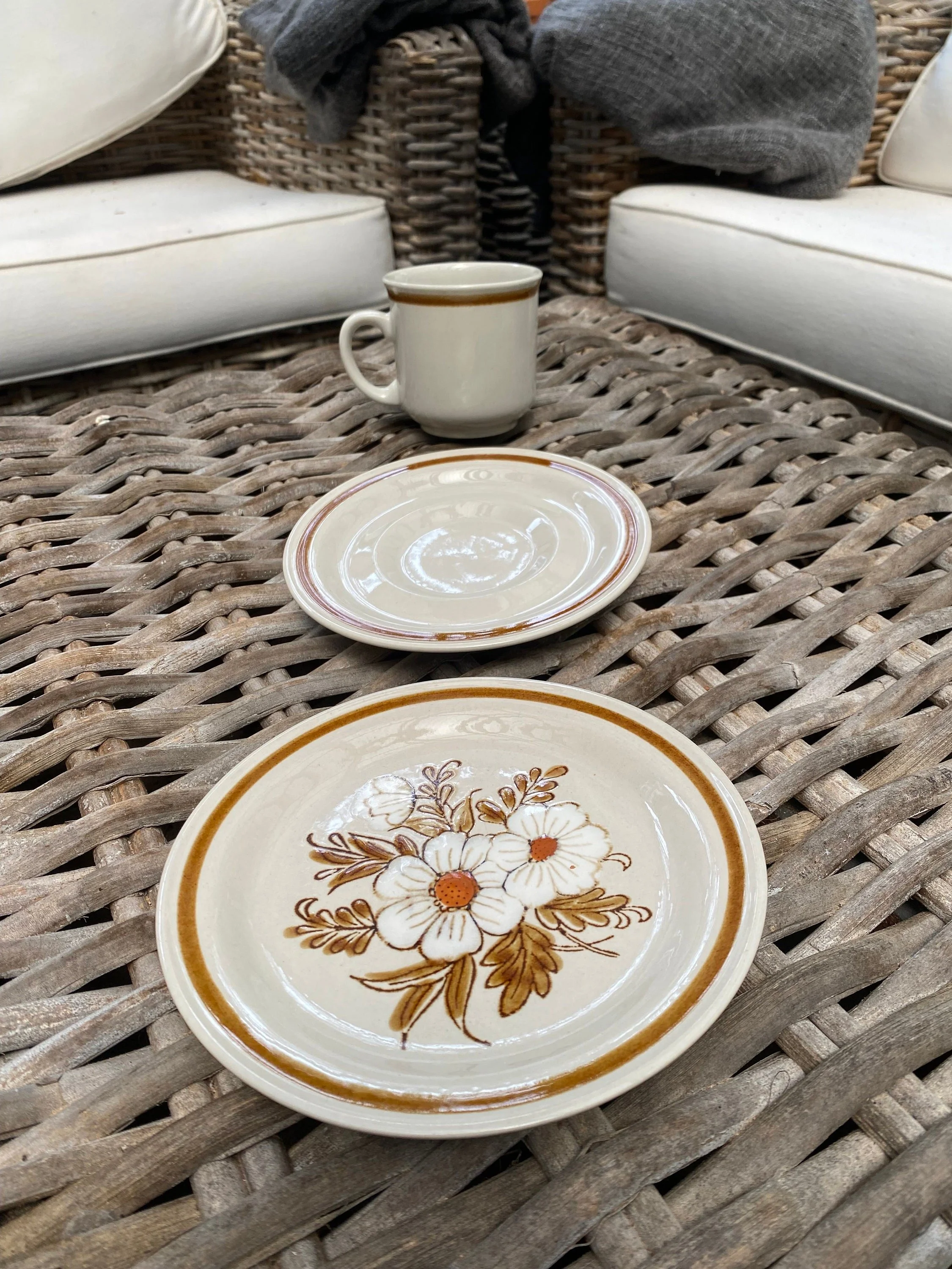 Full trio set displayed on wicker table with white background