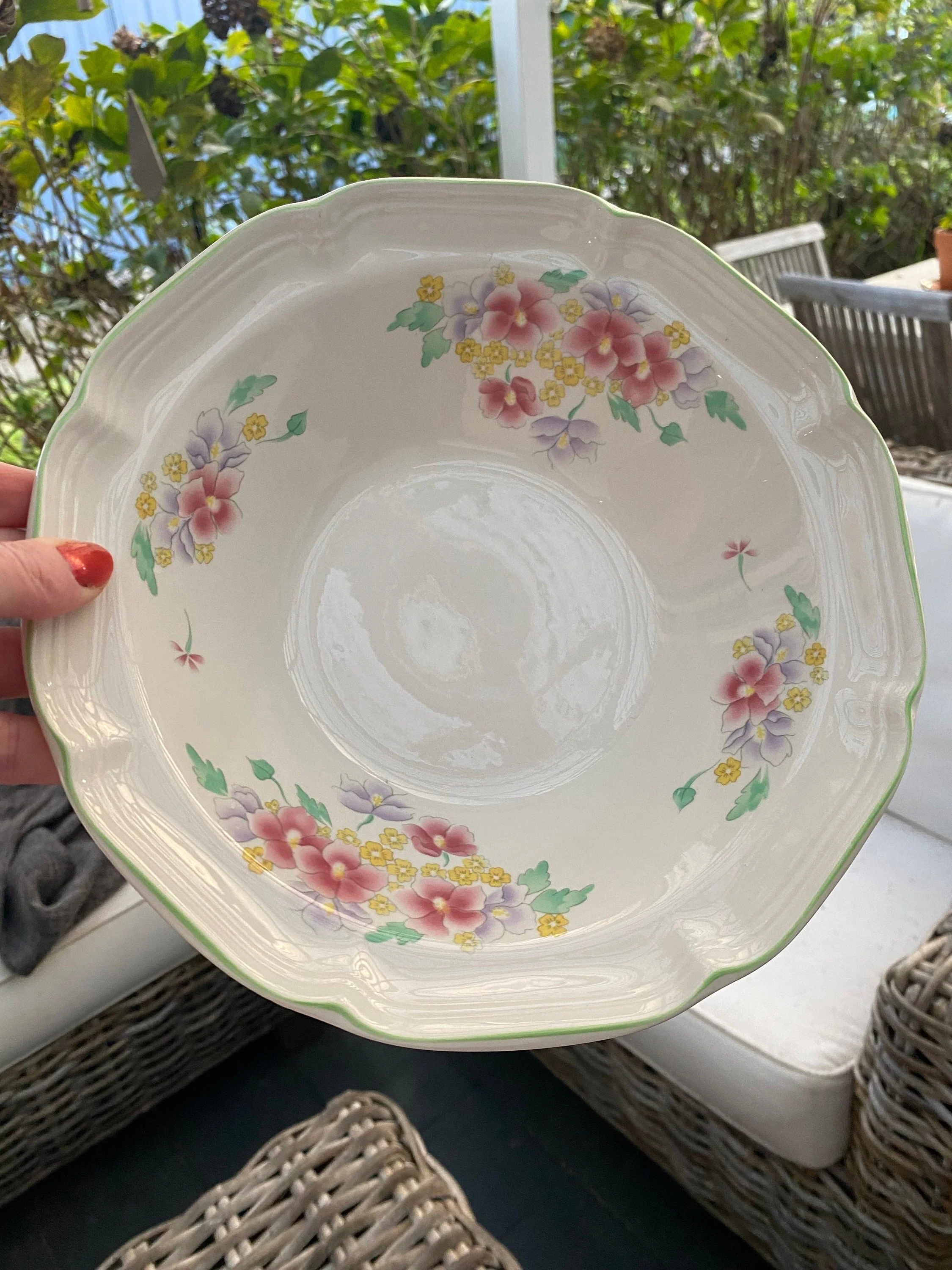 Hand holding bowl to show scale and shape