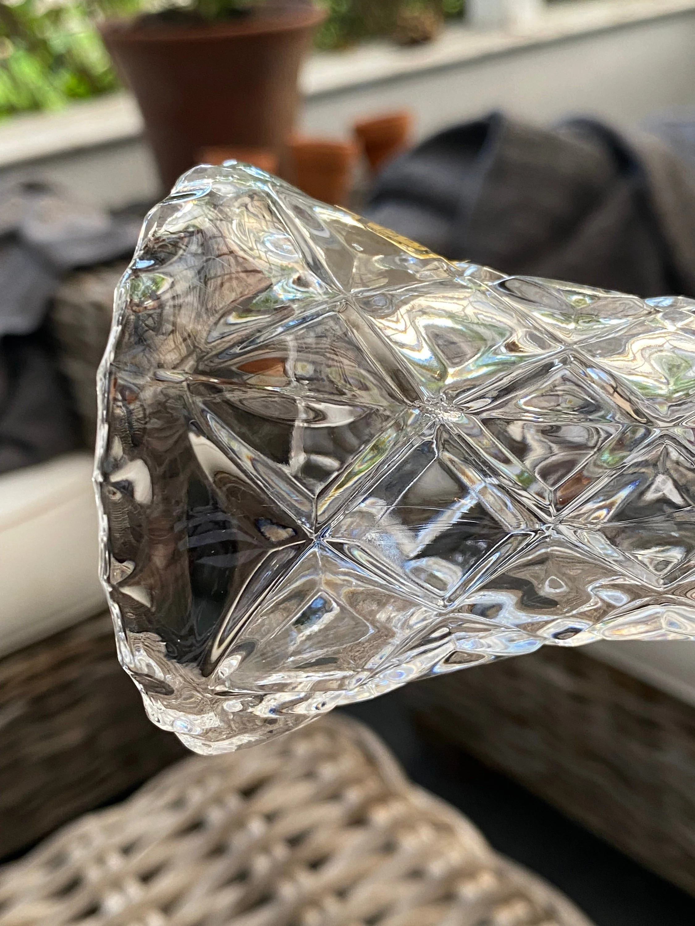 Angled top view into the vase showing the cut crystal pattern and opening