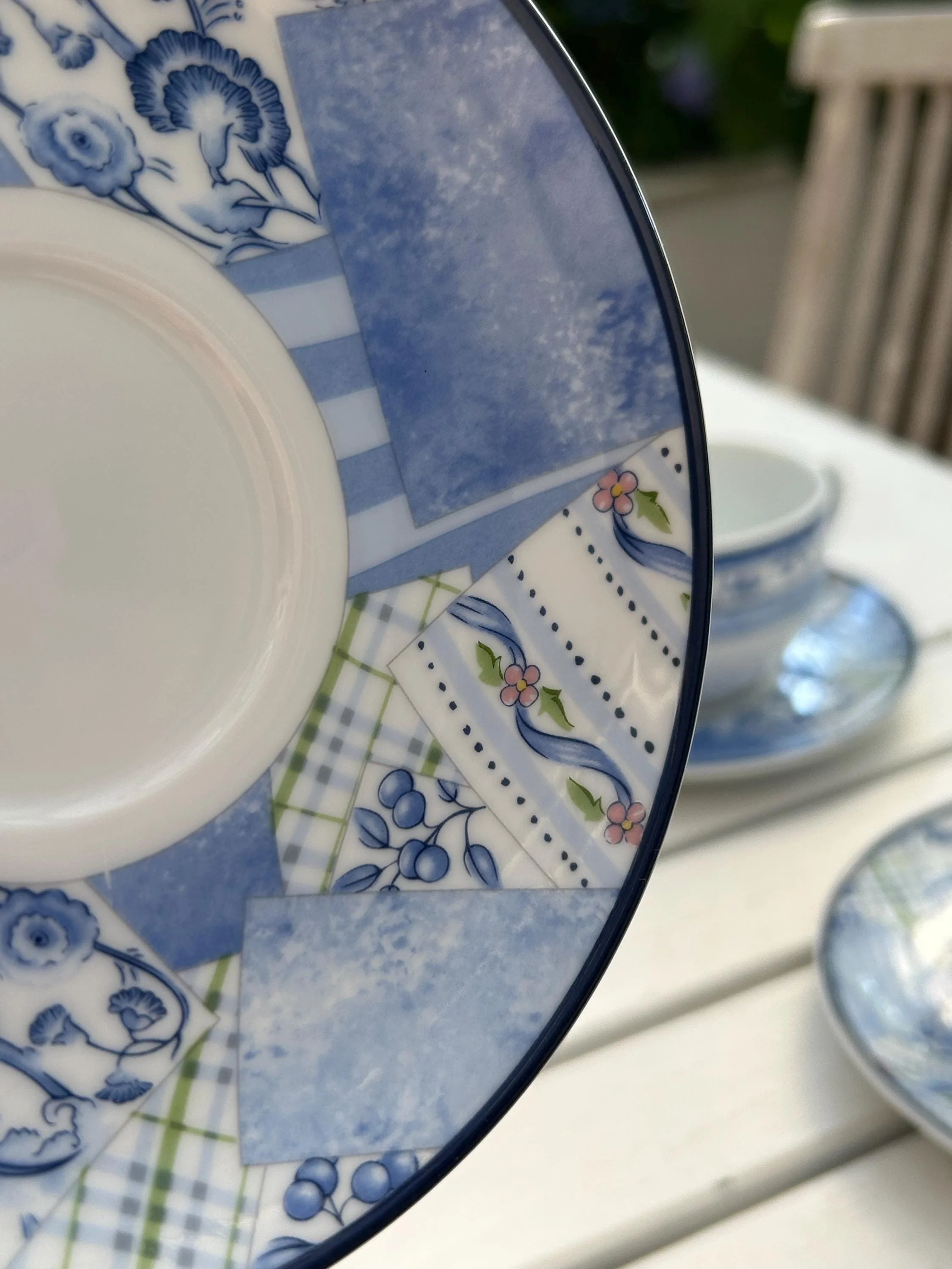 Close-up of the saucer edge and central well showing the detailed Indigo pattern