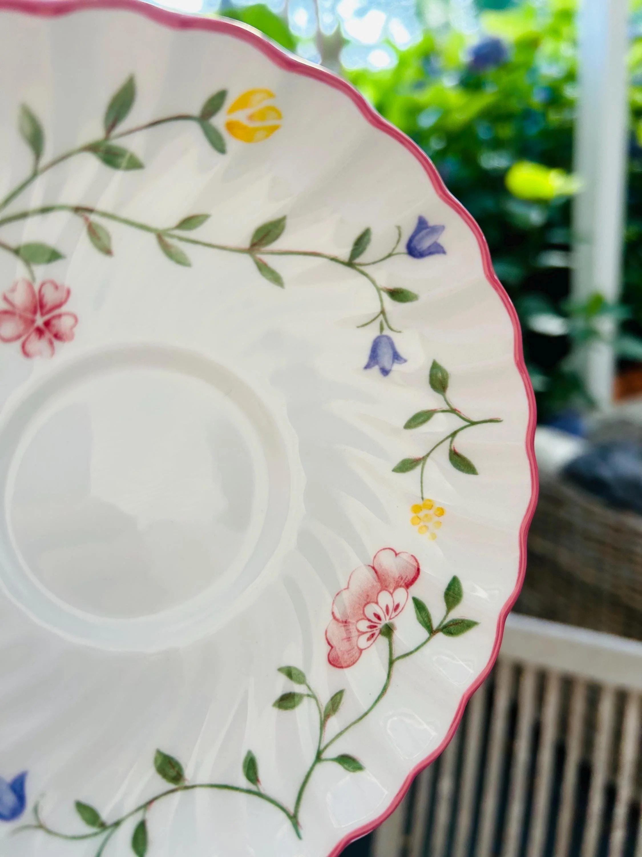 Close-up of floral detail and pink scalloped edging