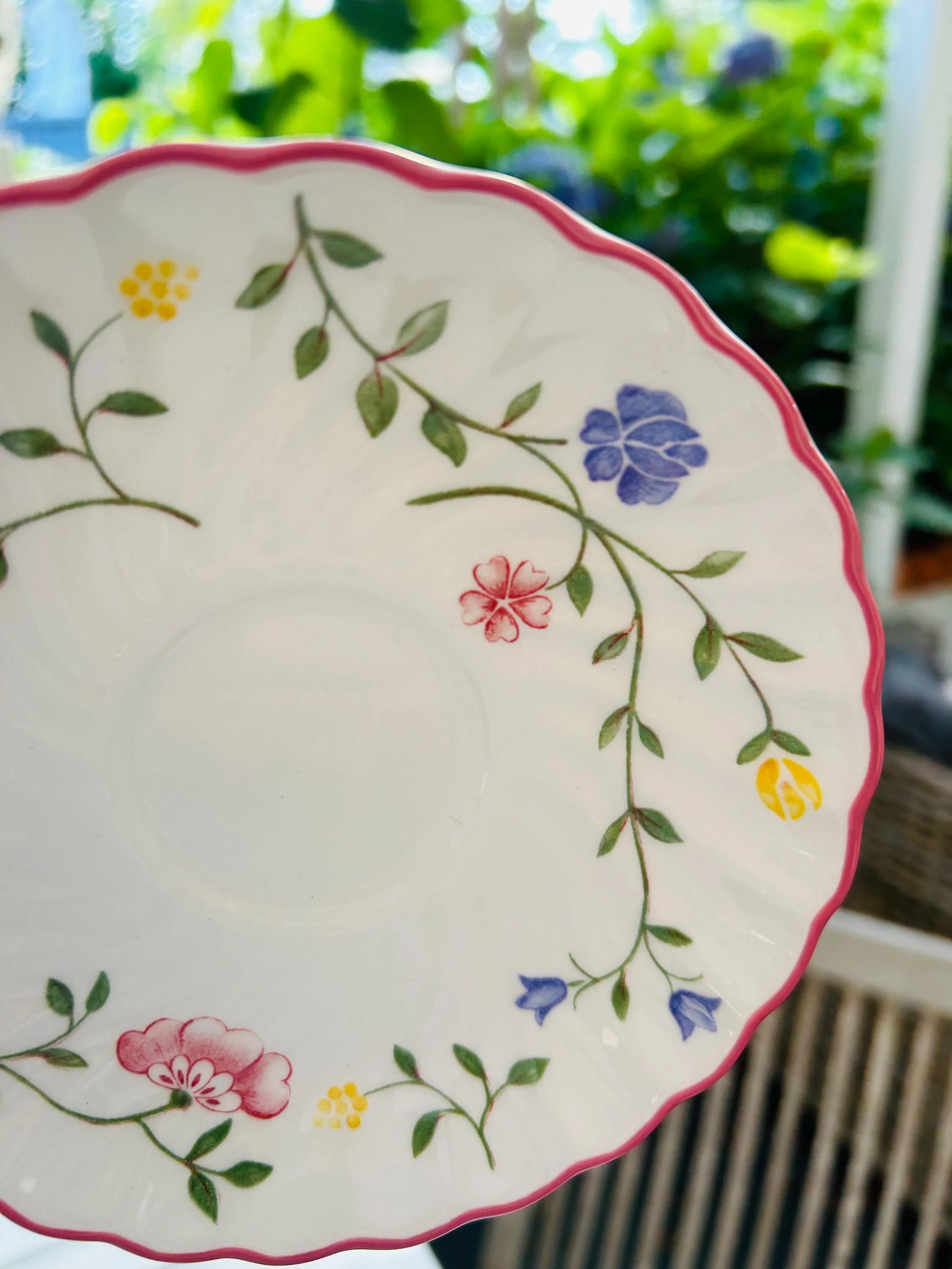 Detail shot of yellow and purple flowers in vine design