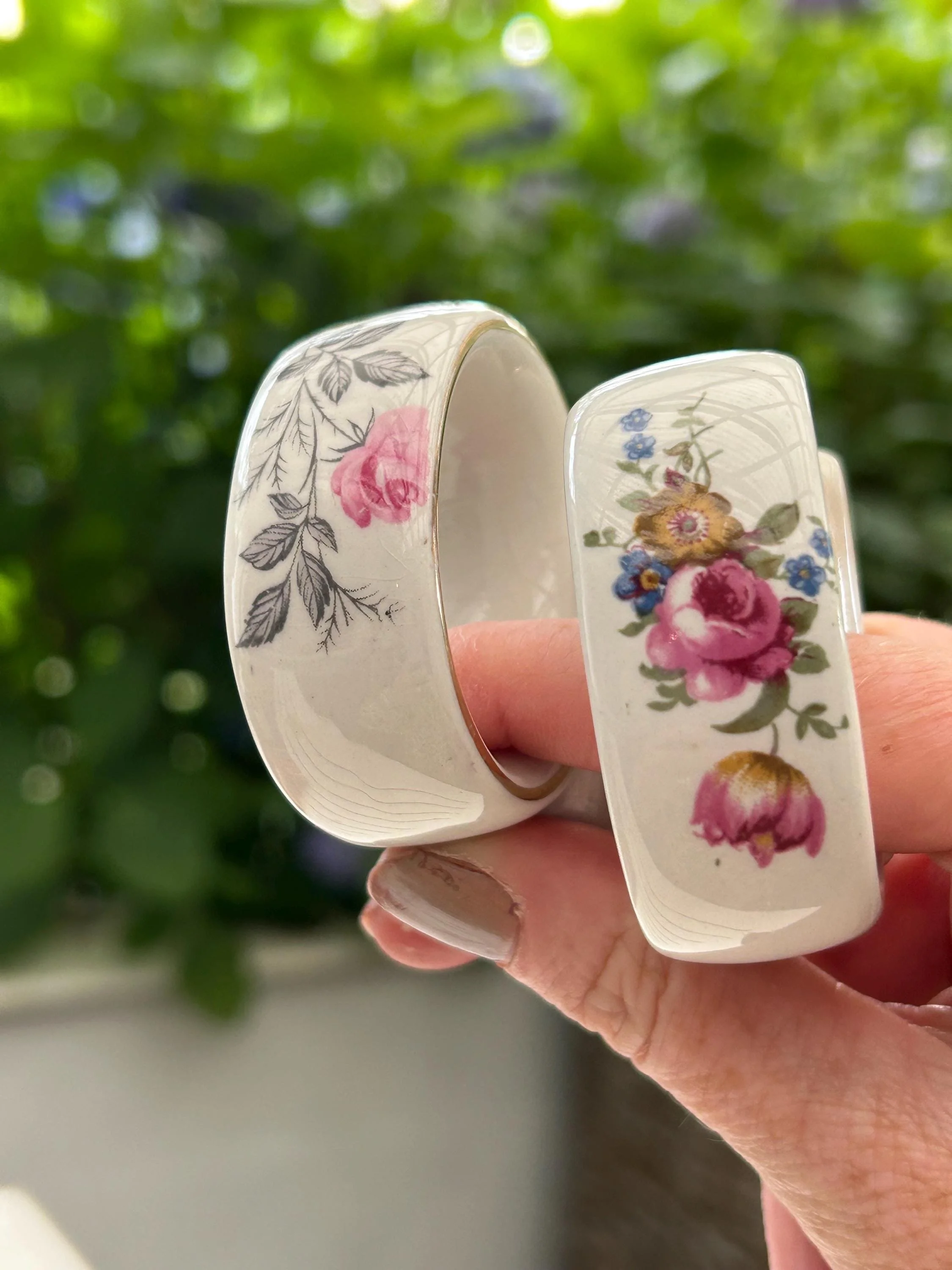 Close-up of each napkin ring showing distinct floral patterns