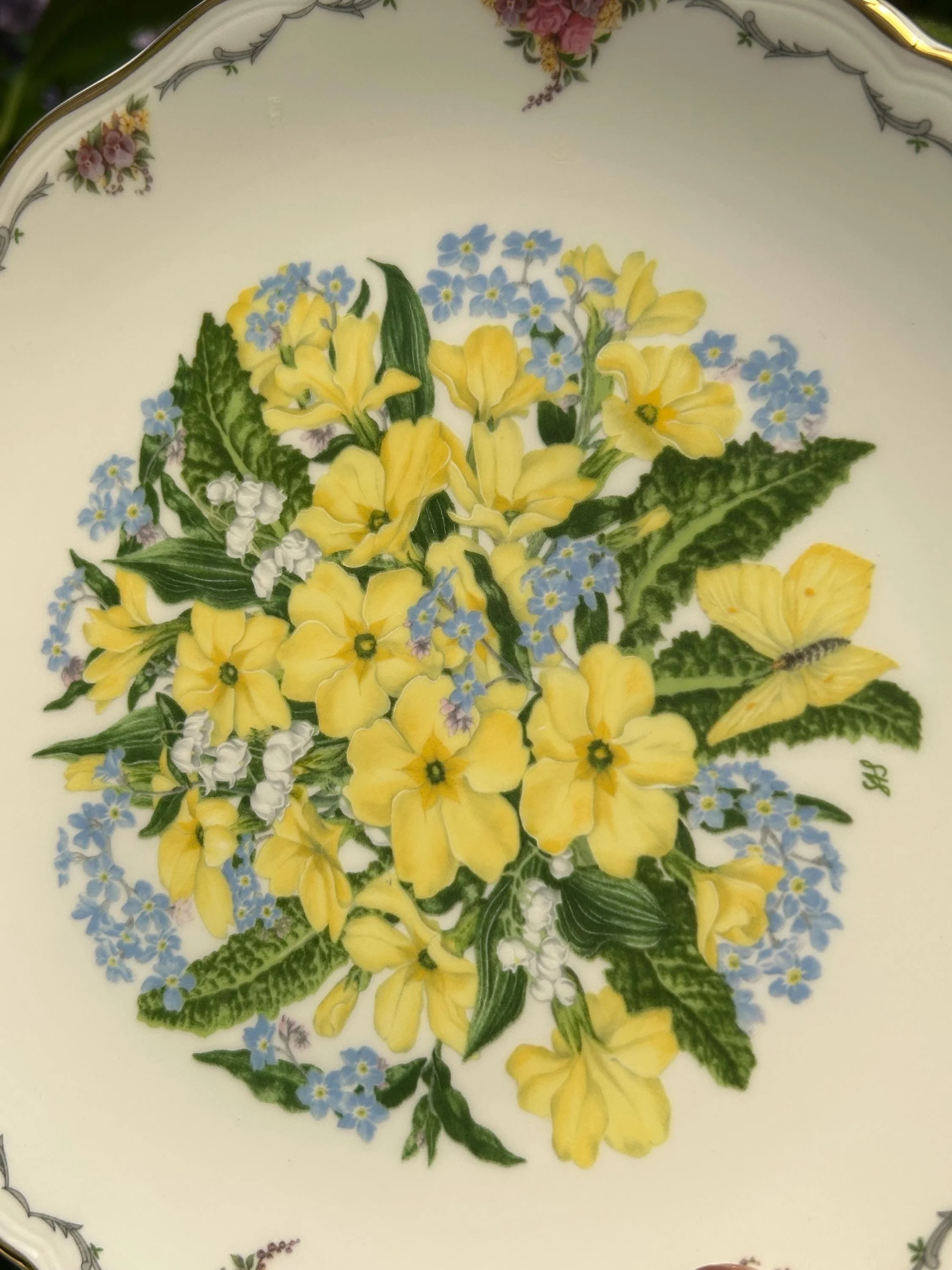 Overhead view of plate showing full floral motif