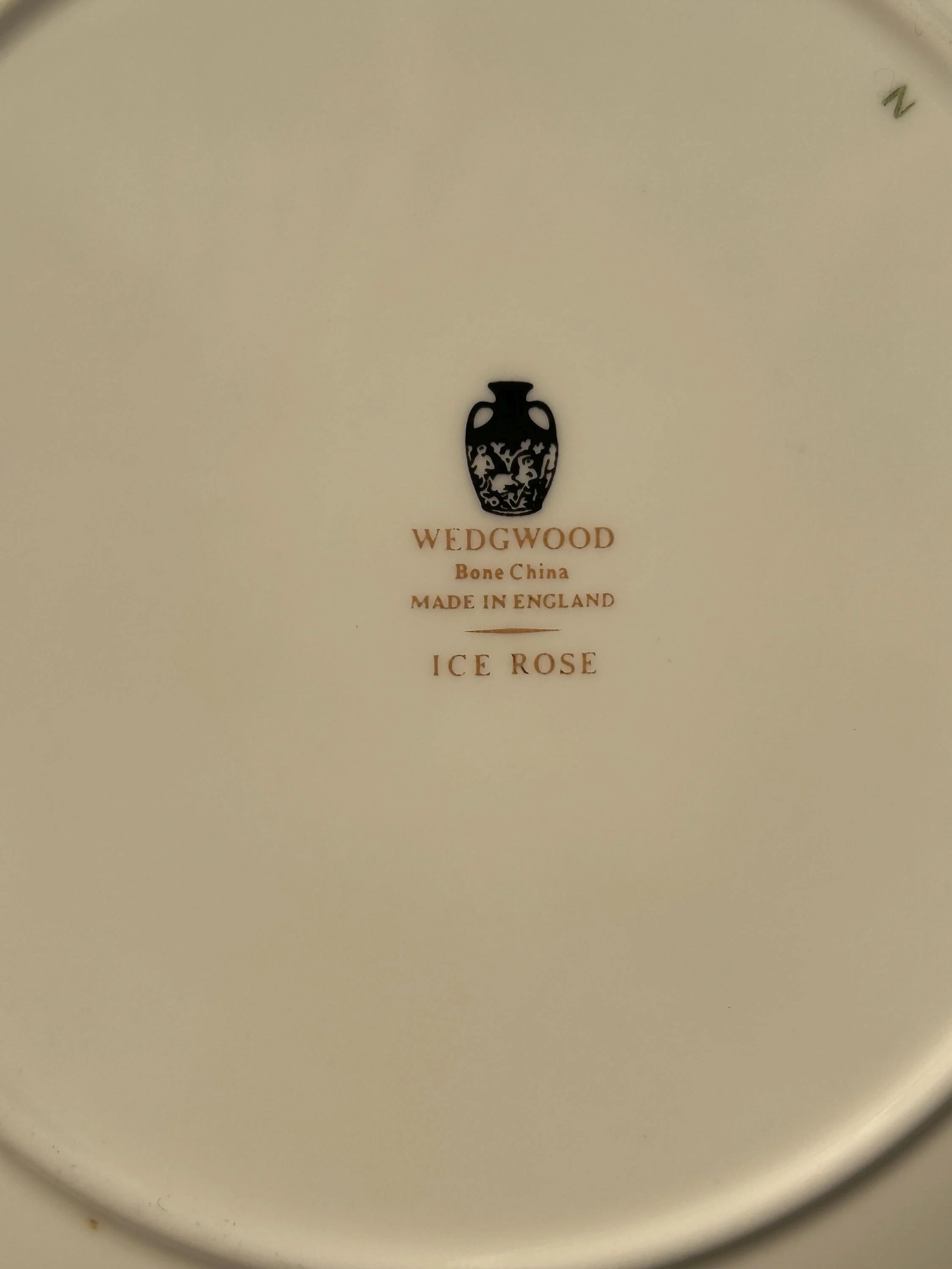 Backstamp on the underside showing Wedgwood Bone China Made in England and Ice Rose pattern name