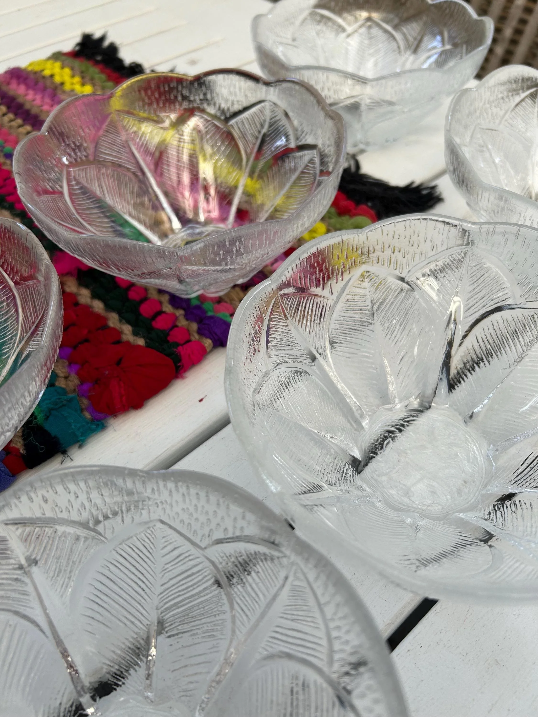 Close-up of the bowls nested together, showing the floral design and textured crystal pattern