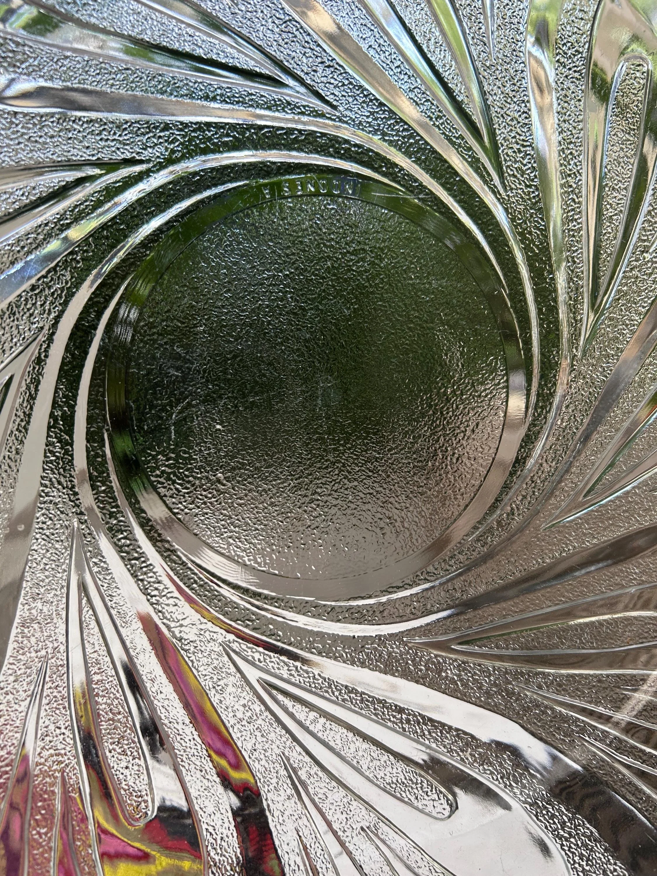 Close-up of swirling pattern and frosted glass texture