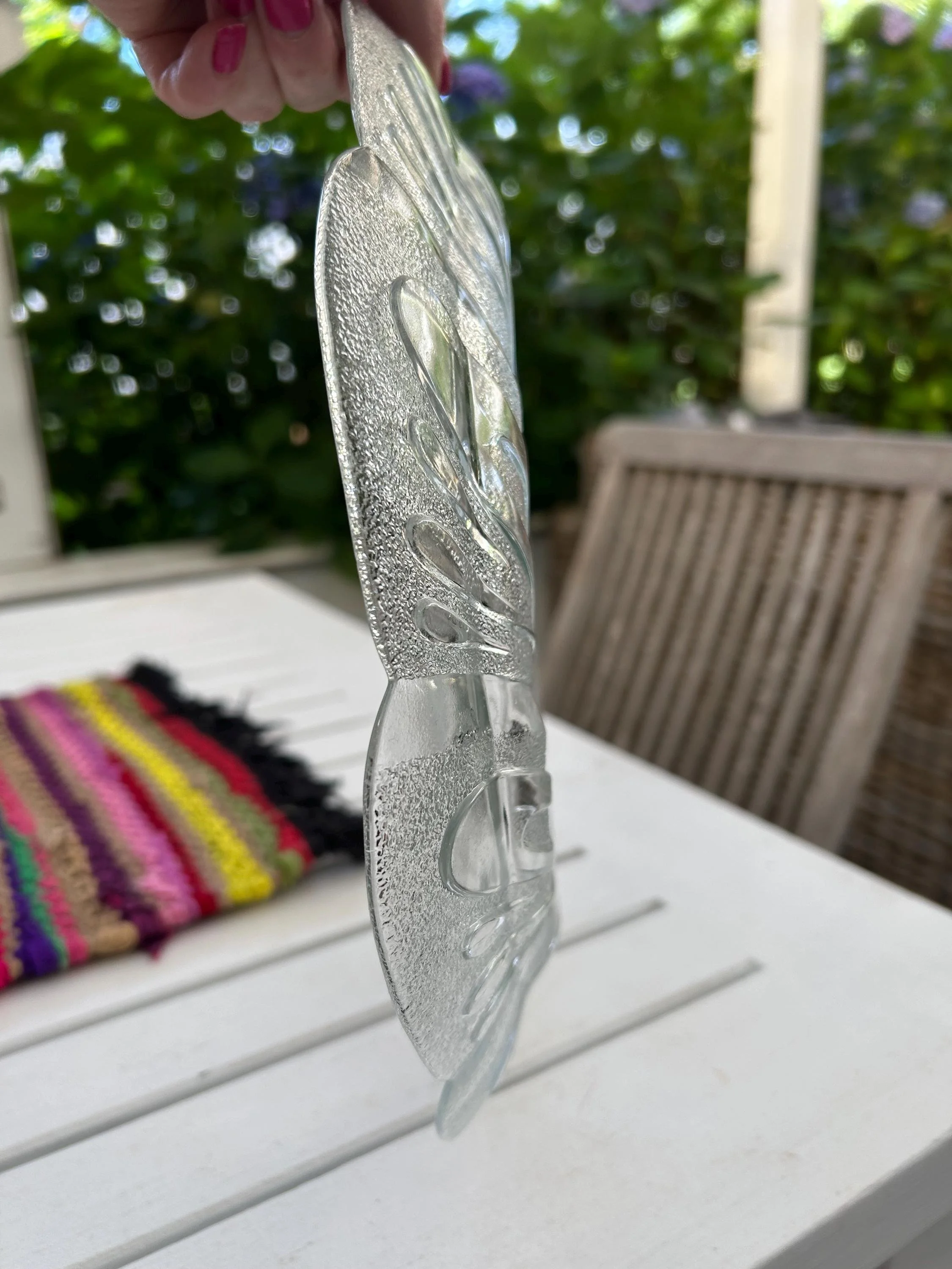 Side view showing depth and scalloped edge profile