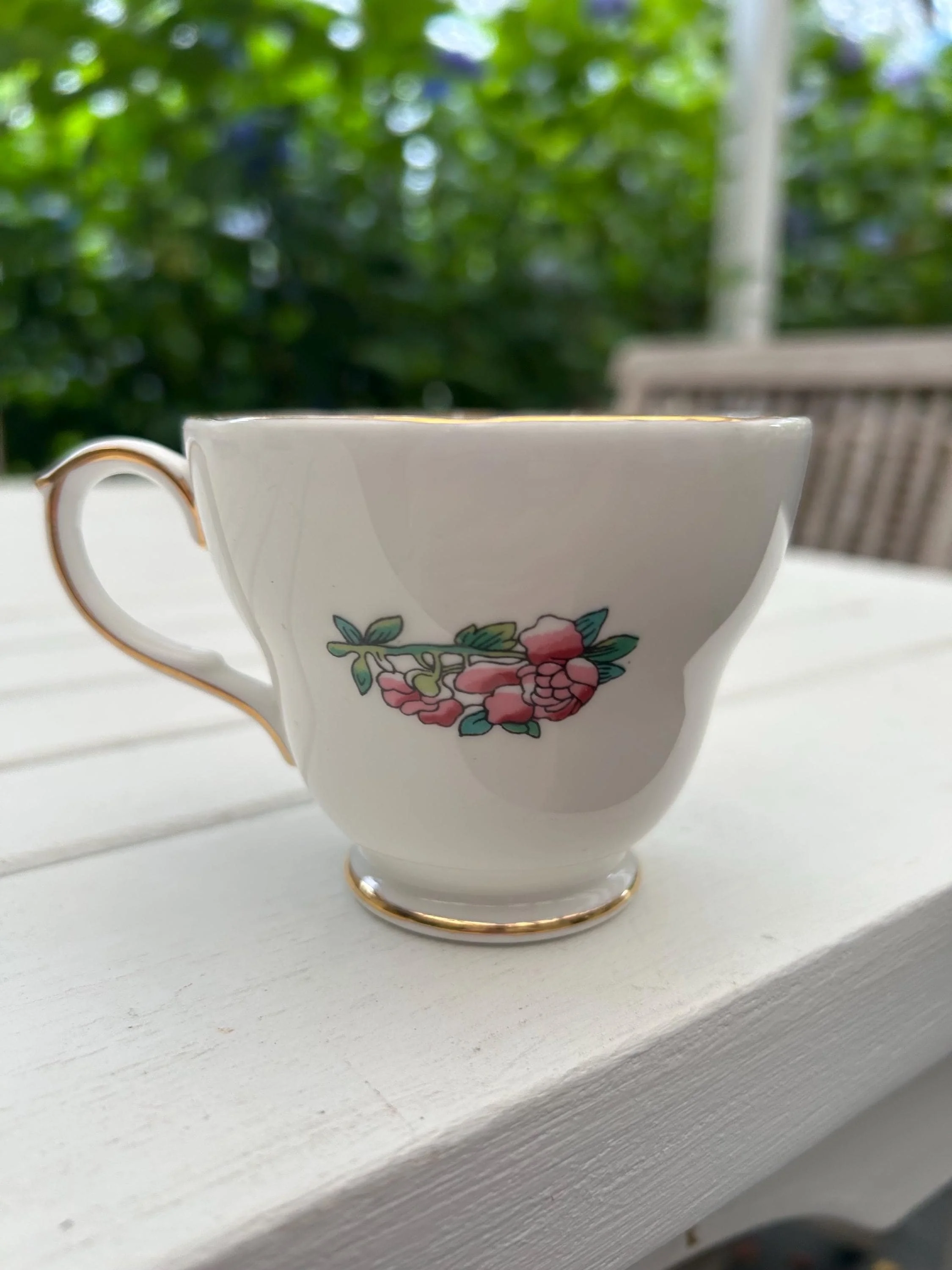 Rear of teacup with floral detail and handle