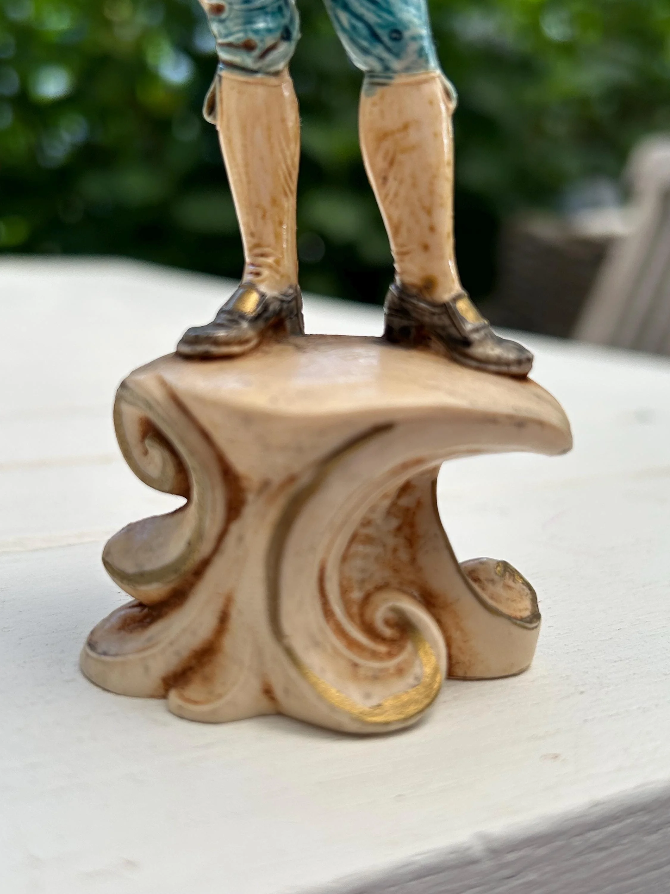 Detailed base with ornate scrollwork design