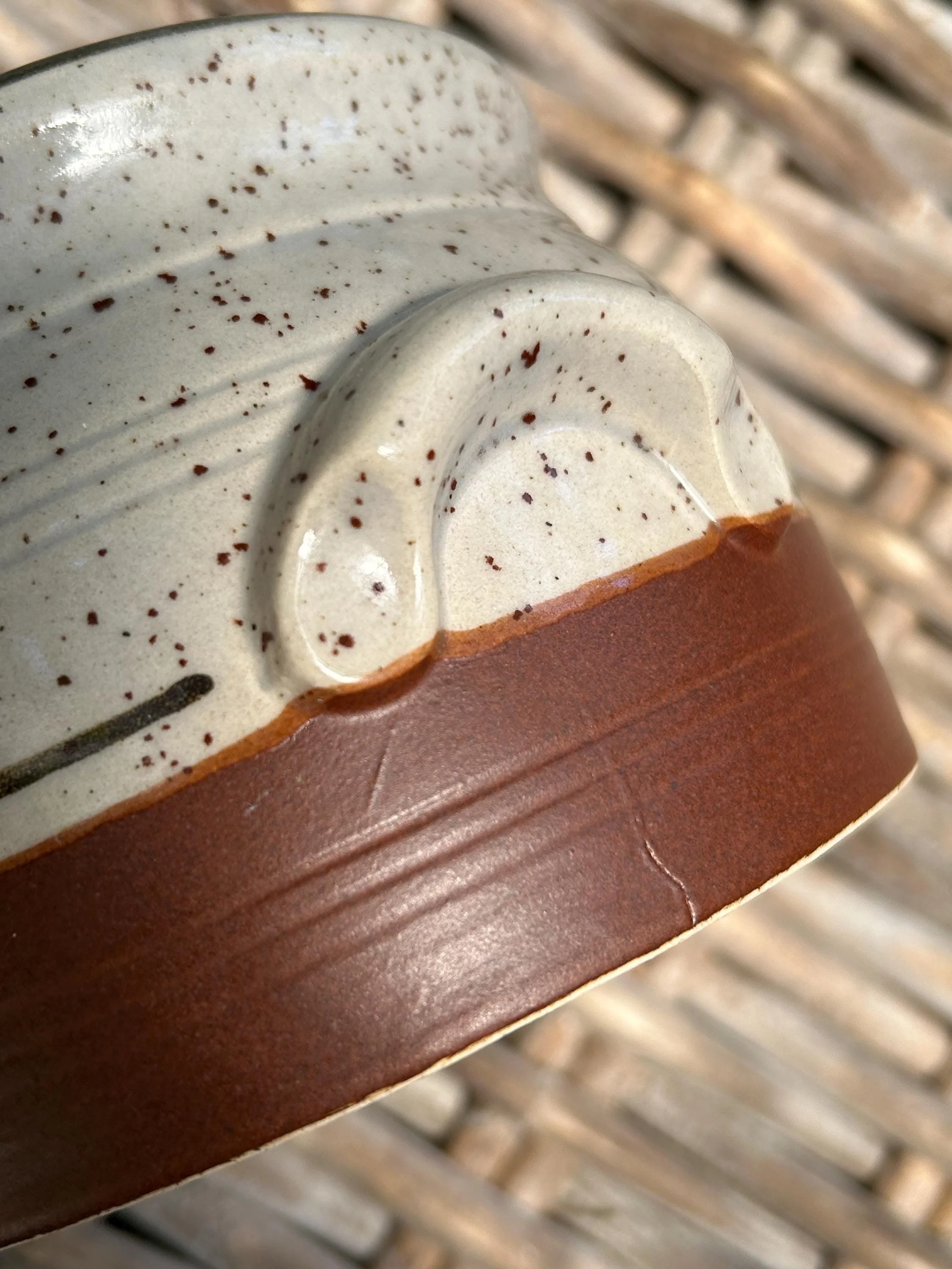 Close-up of handle detail and natural clay tone transition