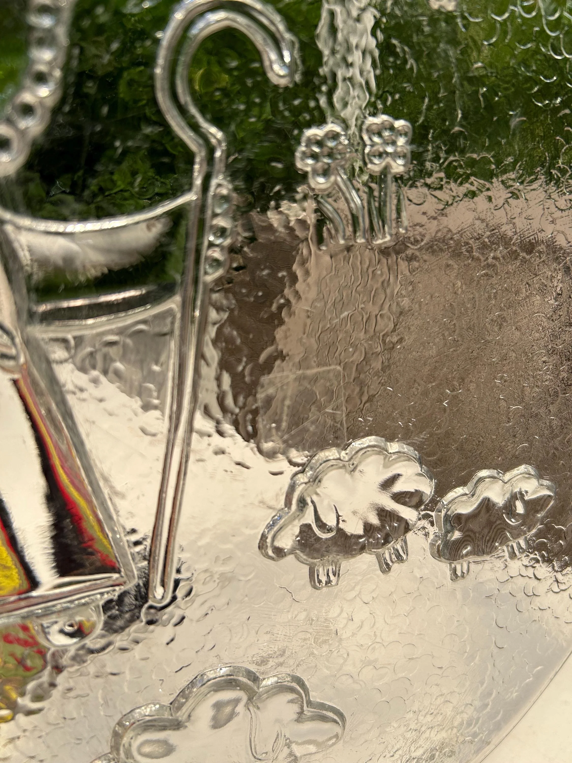 Close-up of shepherd’s crook and surrounding floral accents