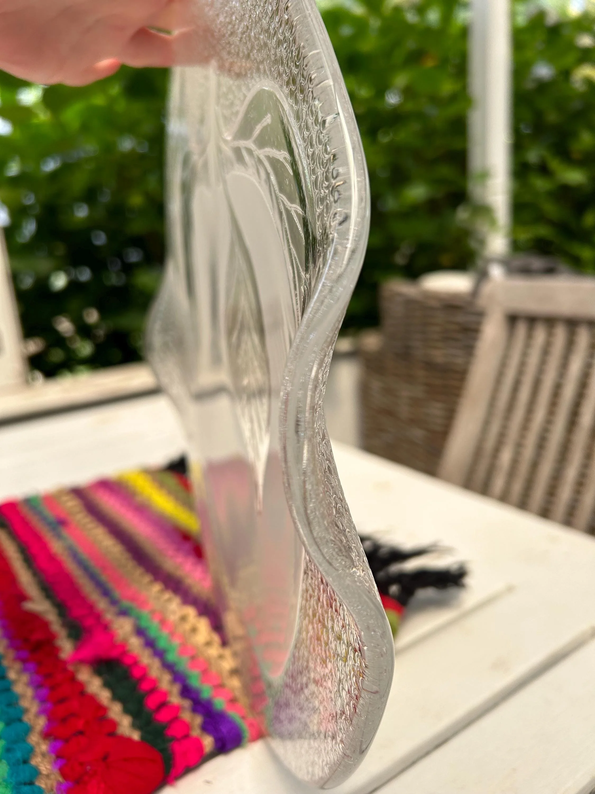 Side view of platter showing slight curve and integrated handle.