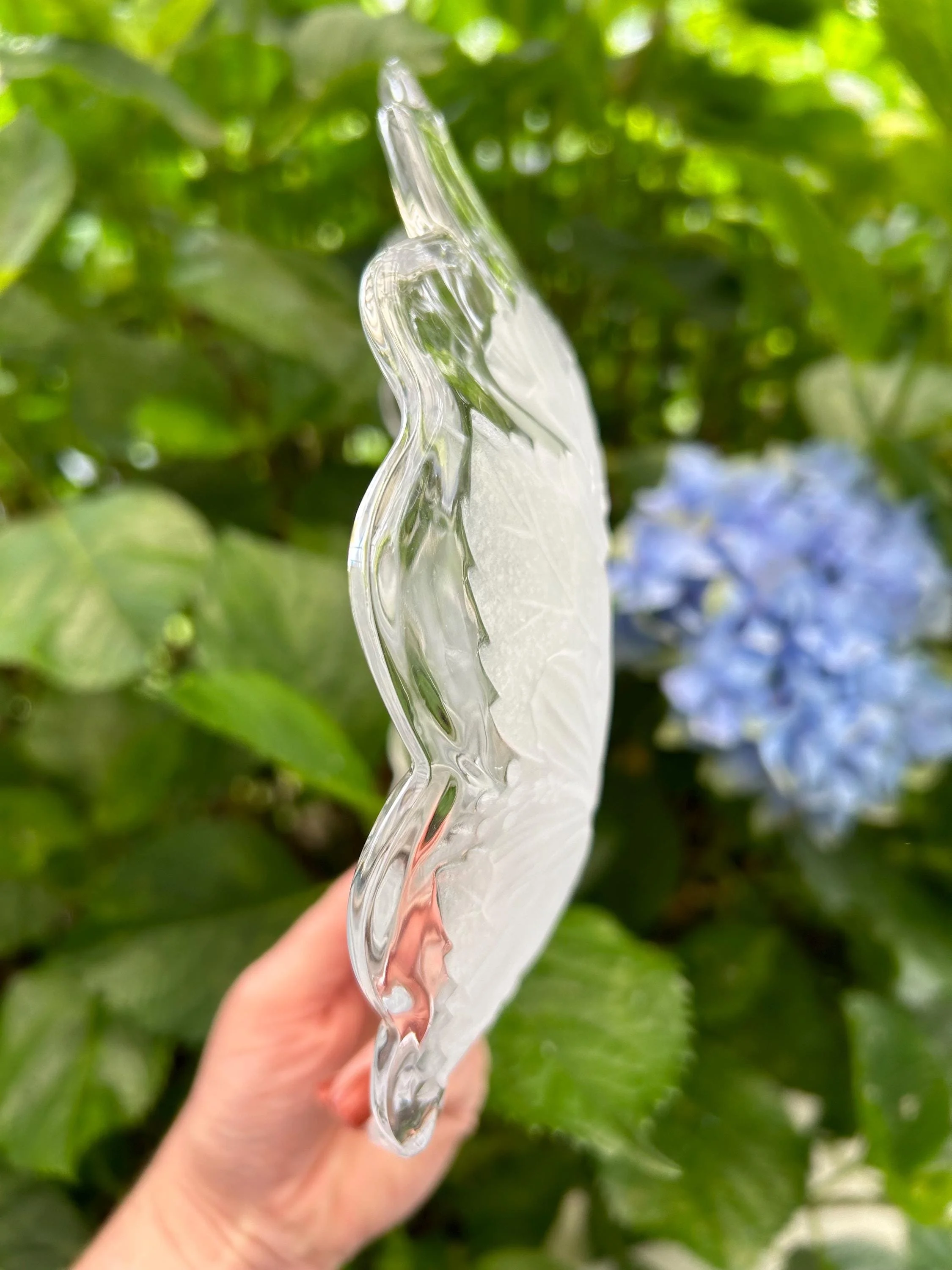 Side profile of bowl showing layered scalloped design.