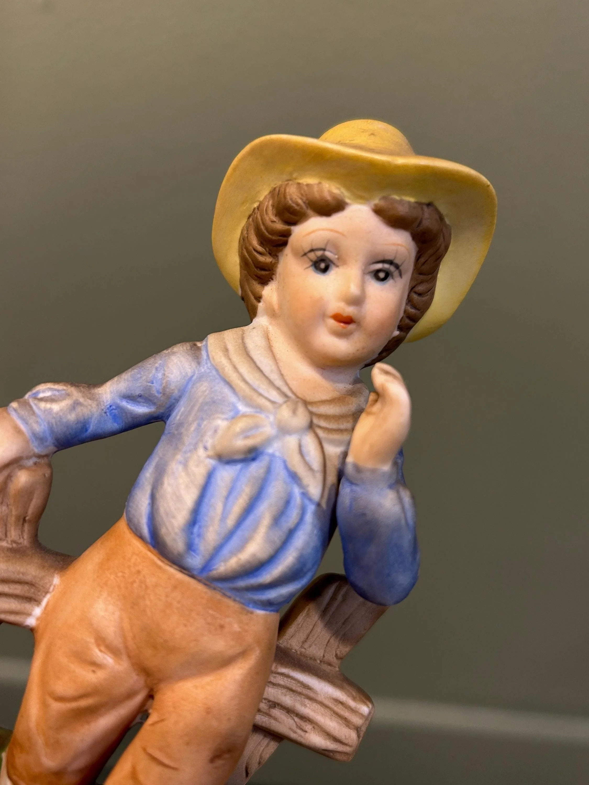 Close-up of boy’s face and hand-painted details in pastel tones