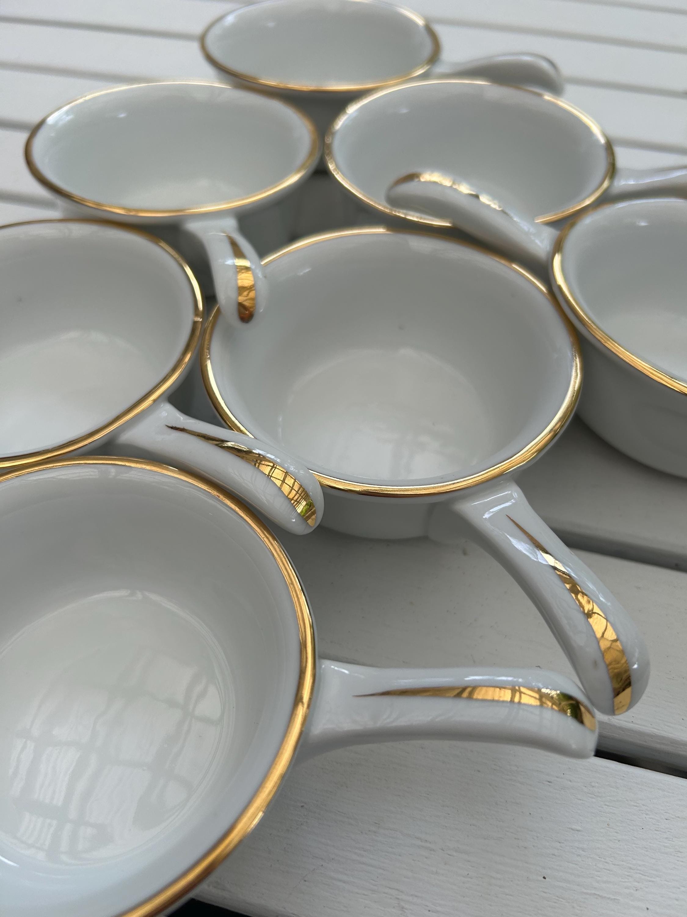 Overhead view of all 7 Royal Worcester ramekins arranged on a white table