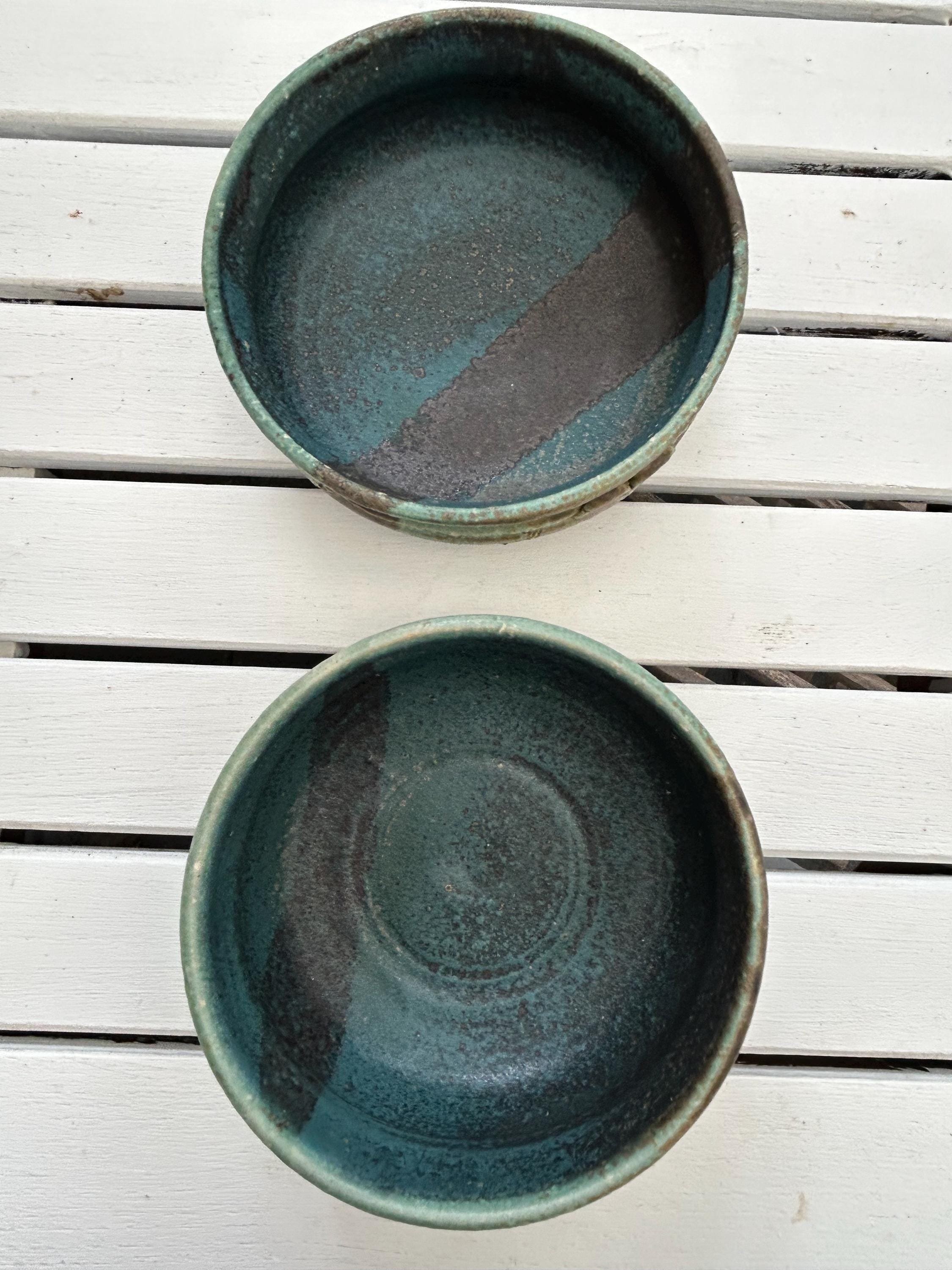 Top-down view of both bowls with semi-gloss interior in deep blue and brown tones
