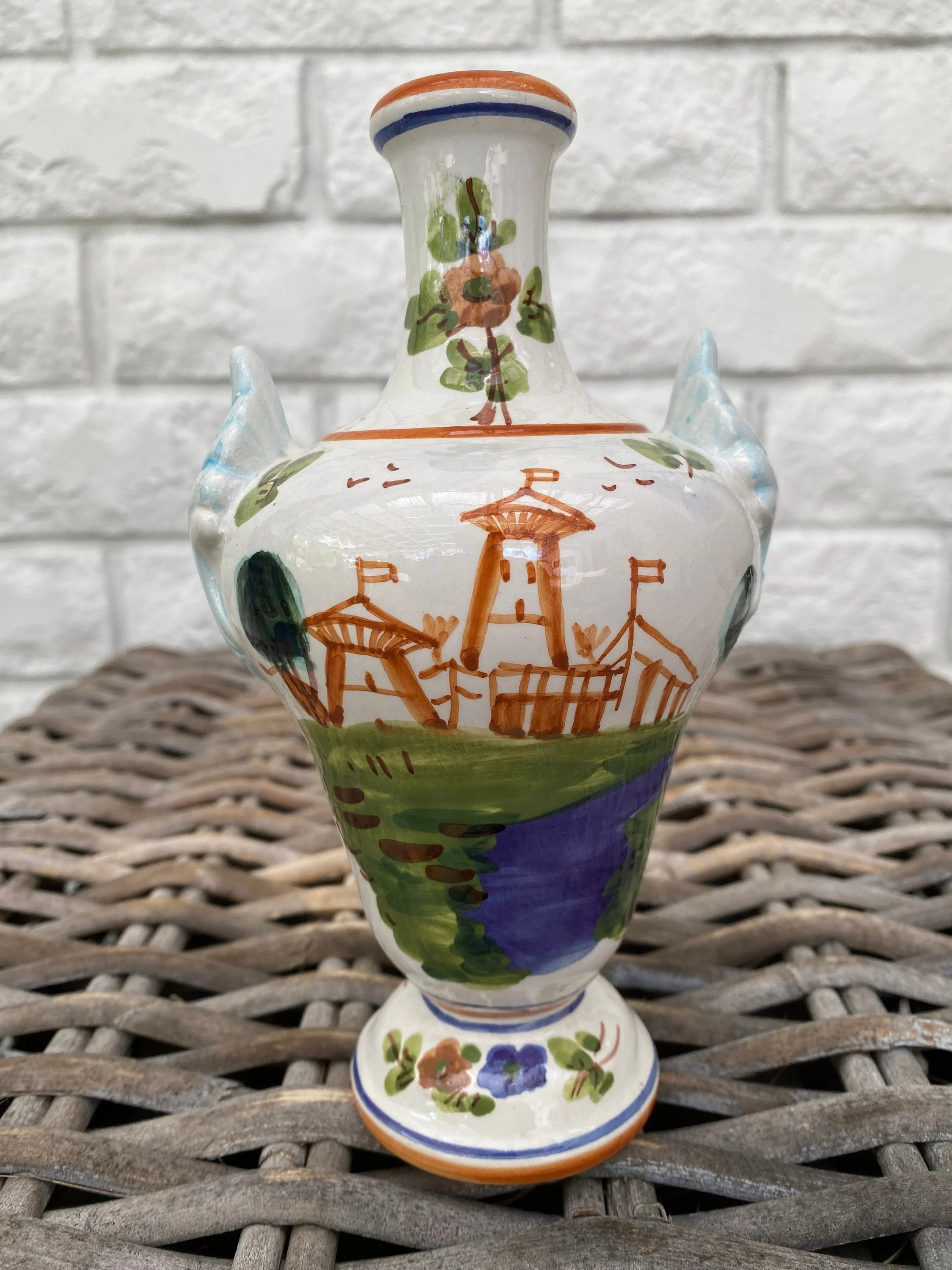 Frontal view of LUXARDO porcelain vase showing hand-painted fortress scene