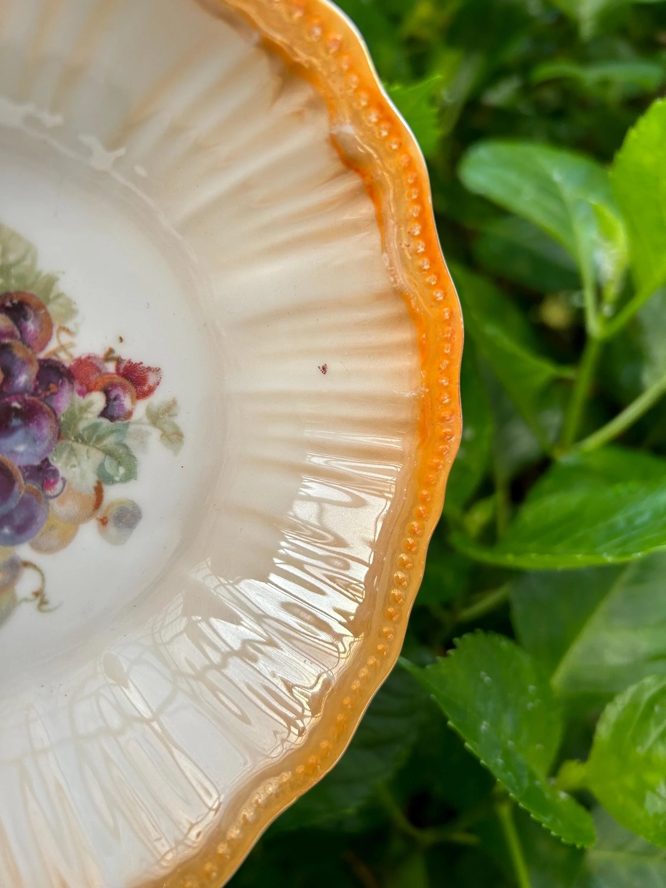 Close-up of grape motif and inner ribbing