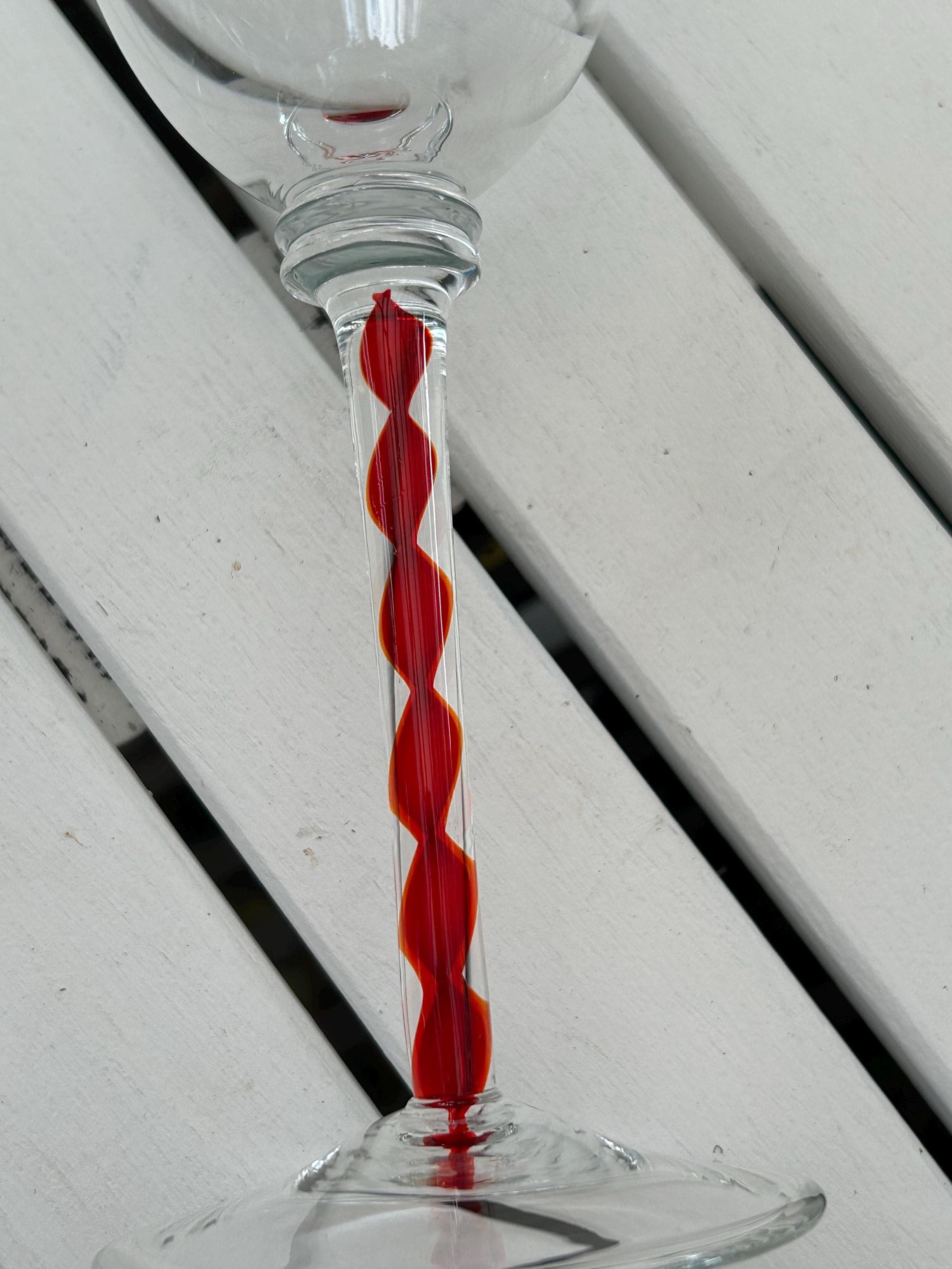 Stem detail with close-up of red ribbon swirl