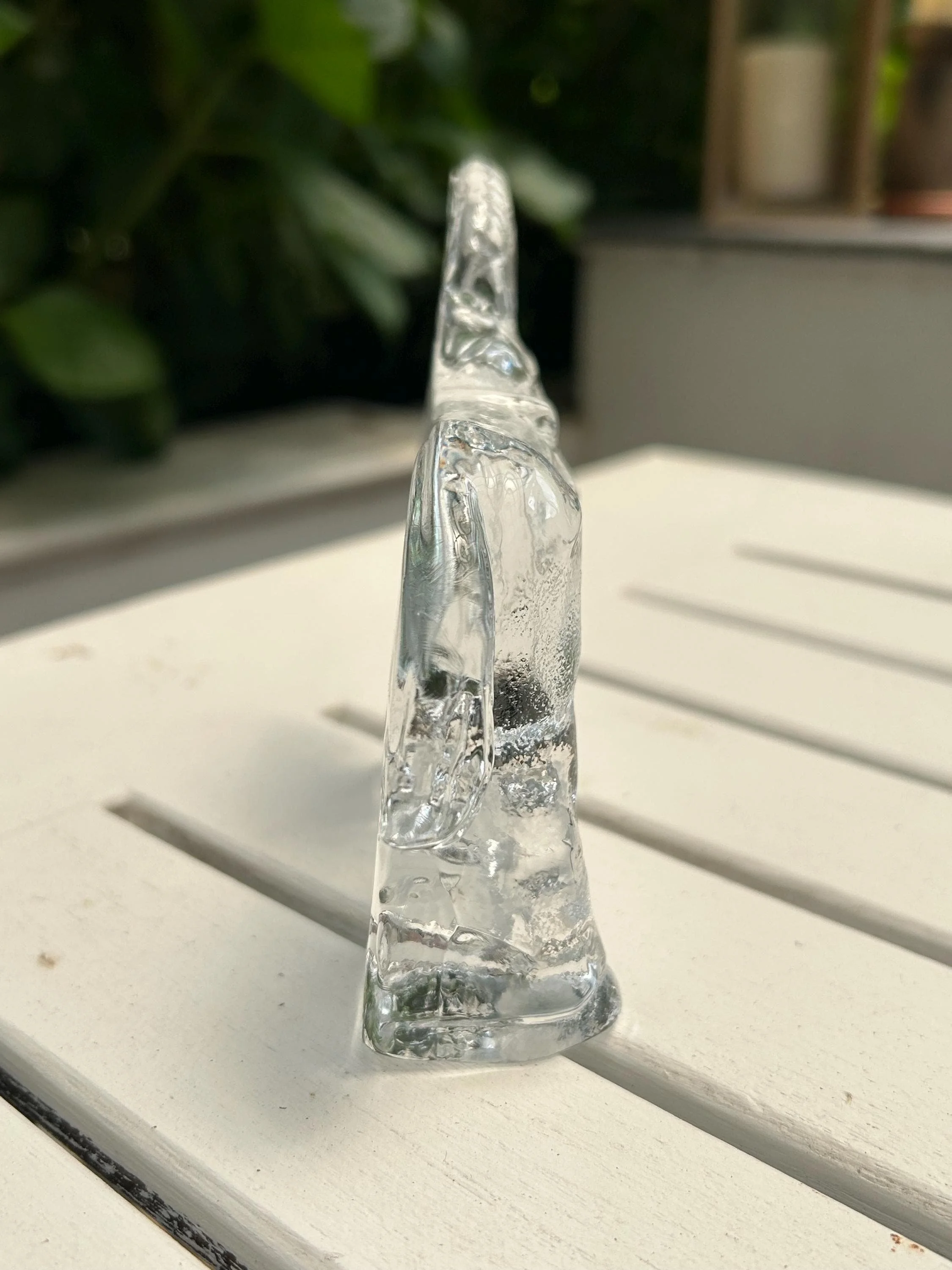 Rear view of the figurine showing flat back