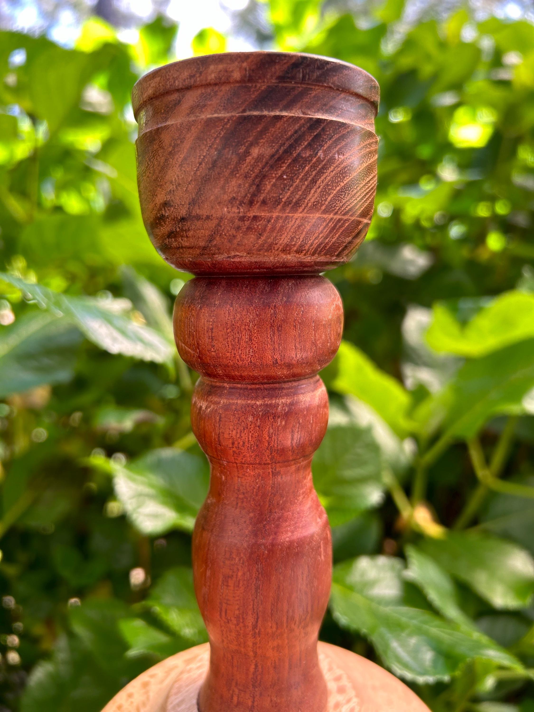 Close-up of dark wood candle cup showing grain texture