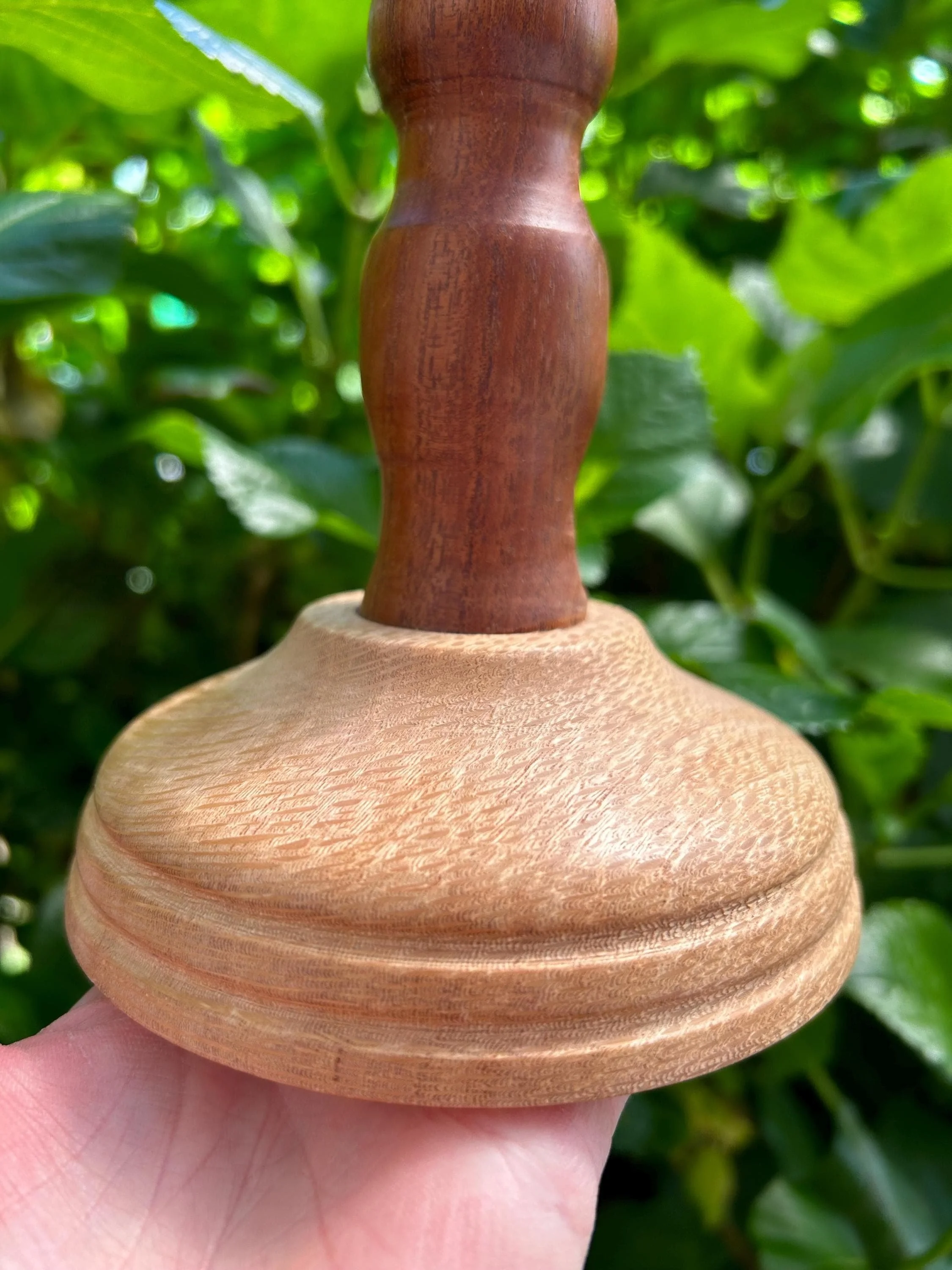 Base close-up showing lighter wood and smooth craftsmanship