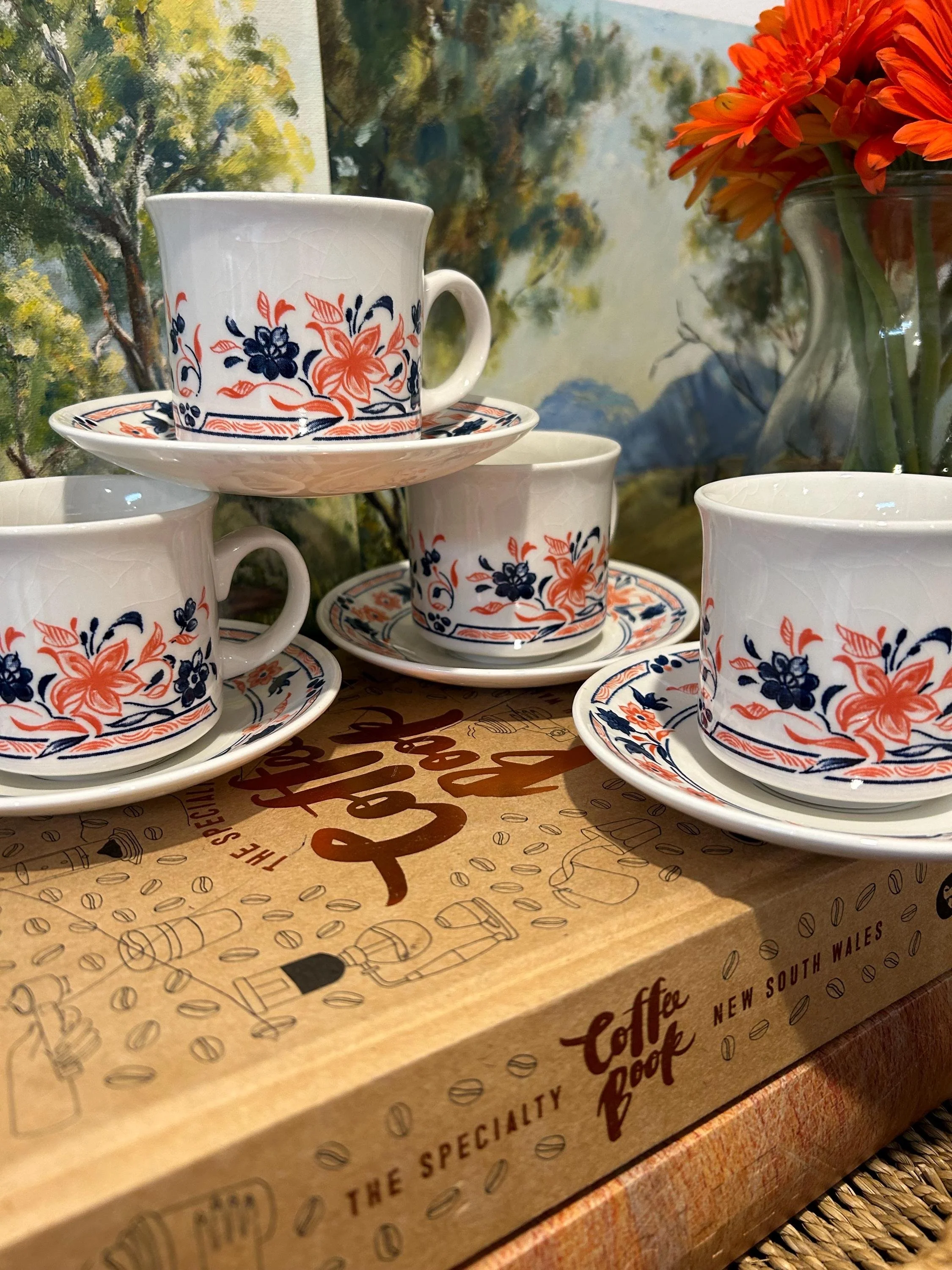 A vintage Churchill 'Imari' coffee cup & saucer set (1980s-1990s) featuring a bold floral blue & red pattern. Made in England, rare & collectible.