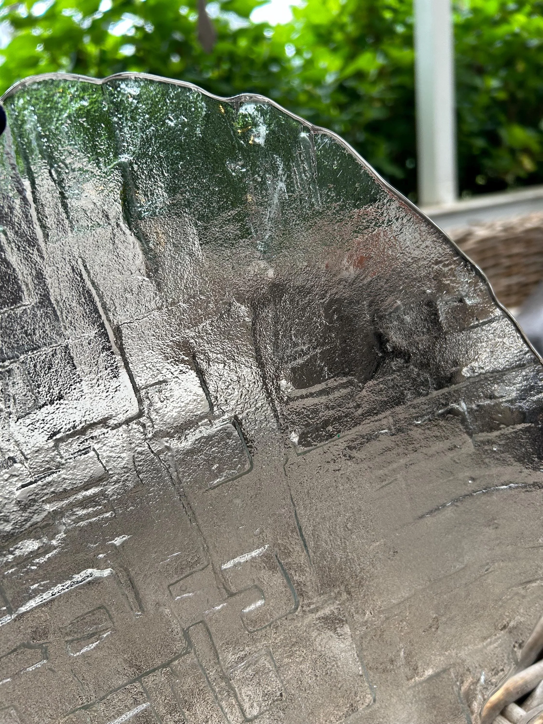 Edge detail of glass showing texture and freeform rim