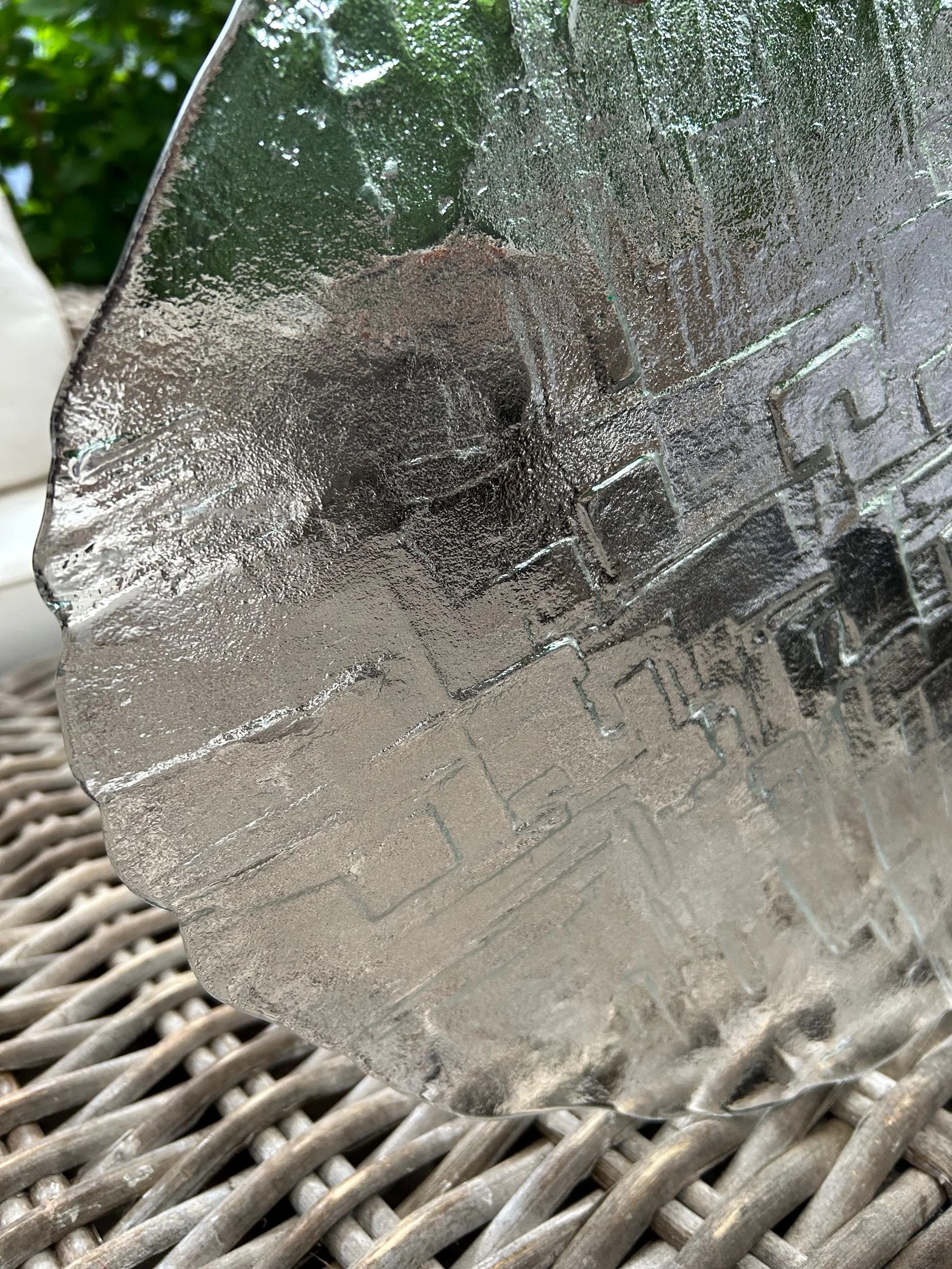 Surface detail from side angle showing raised rectangular reliefs