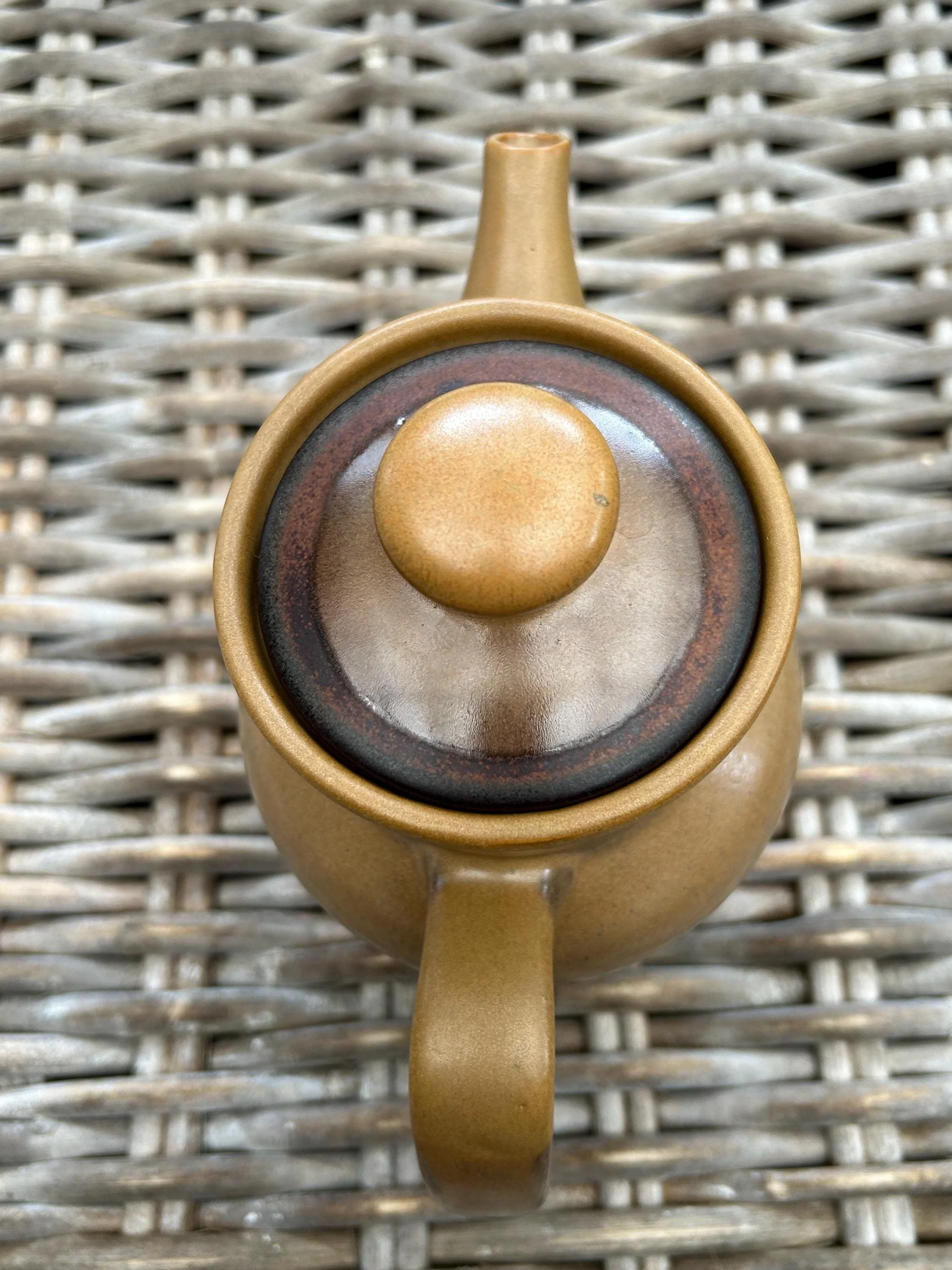 Overhead view of lid and spout showing colour contrast and shape