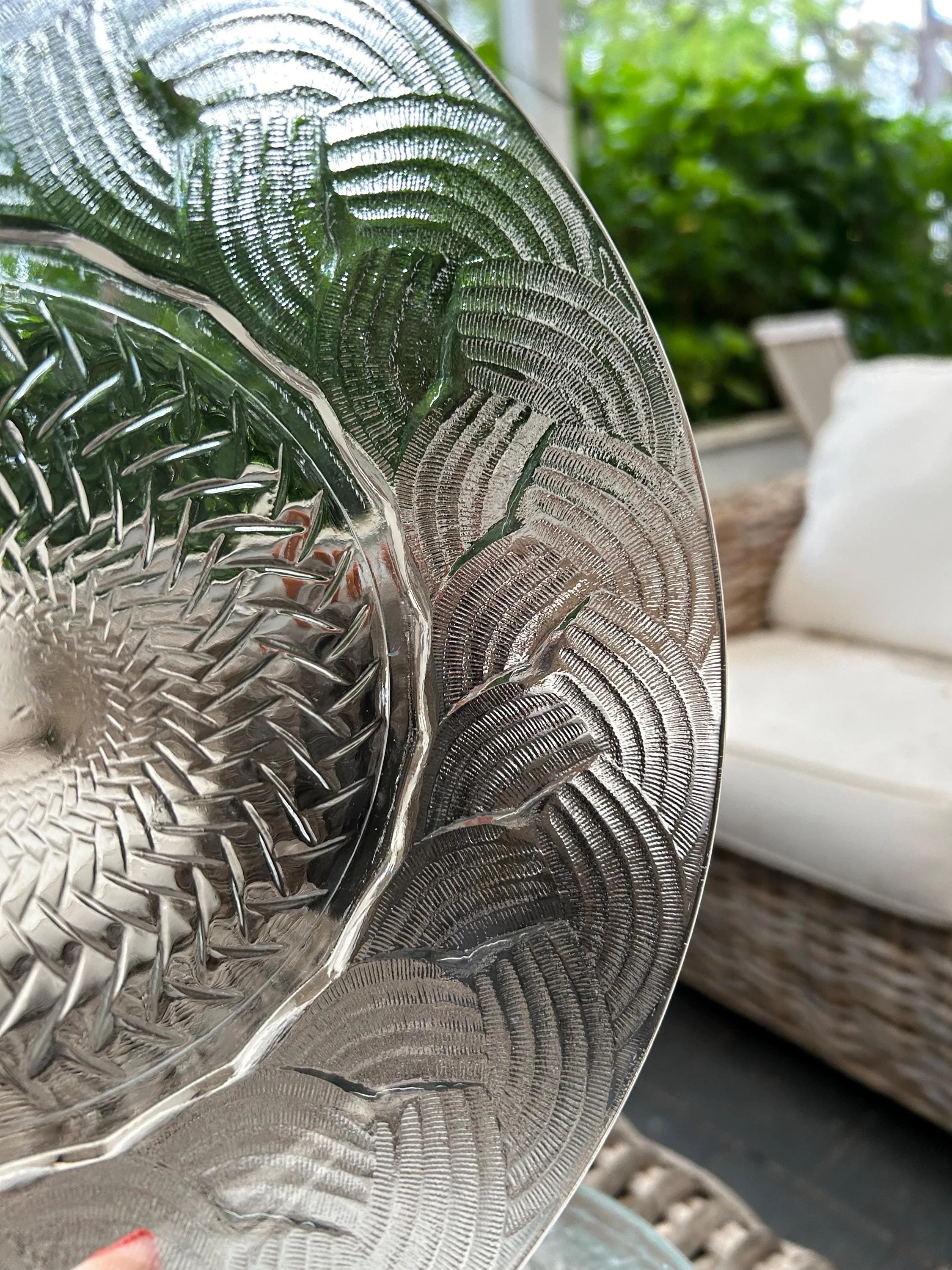 Detailed close-up of frosted leaf pattern in outer rim