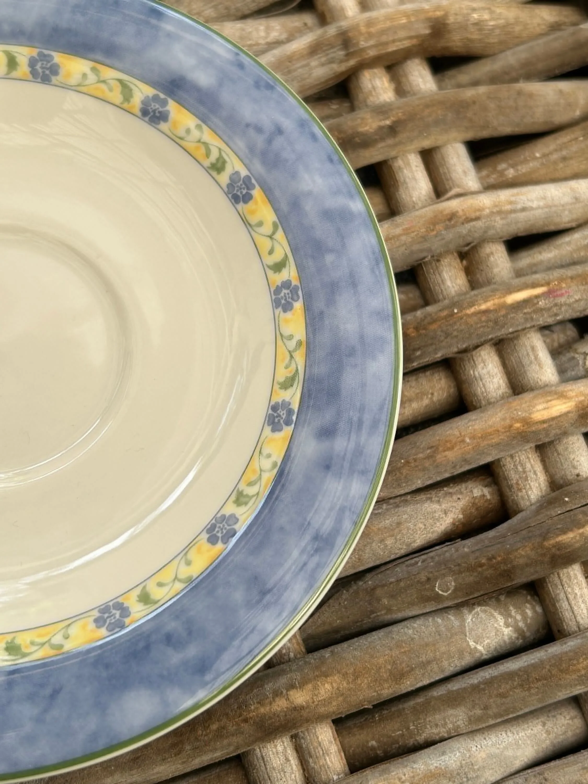 Detailed close-up of yellow floral band and dusky blue outer rim