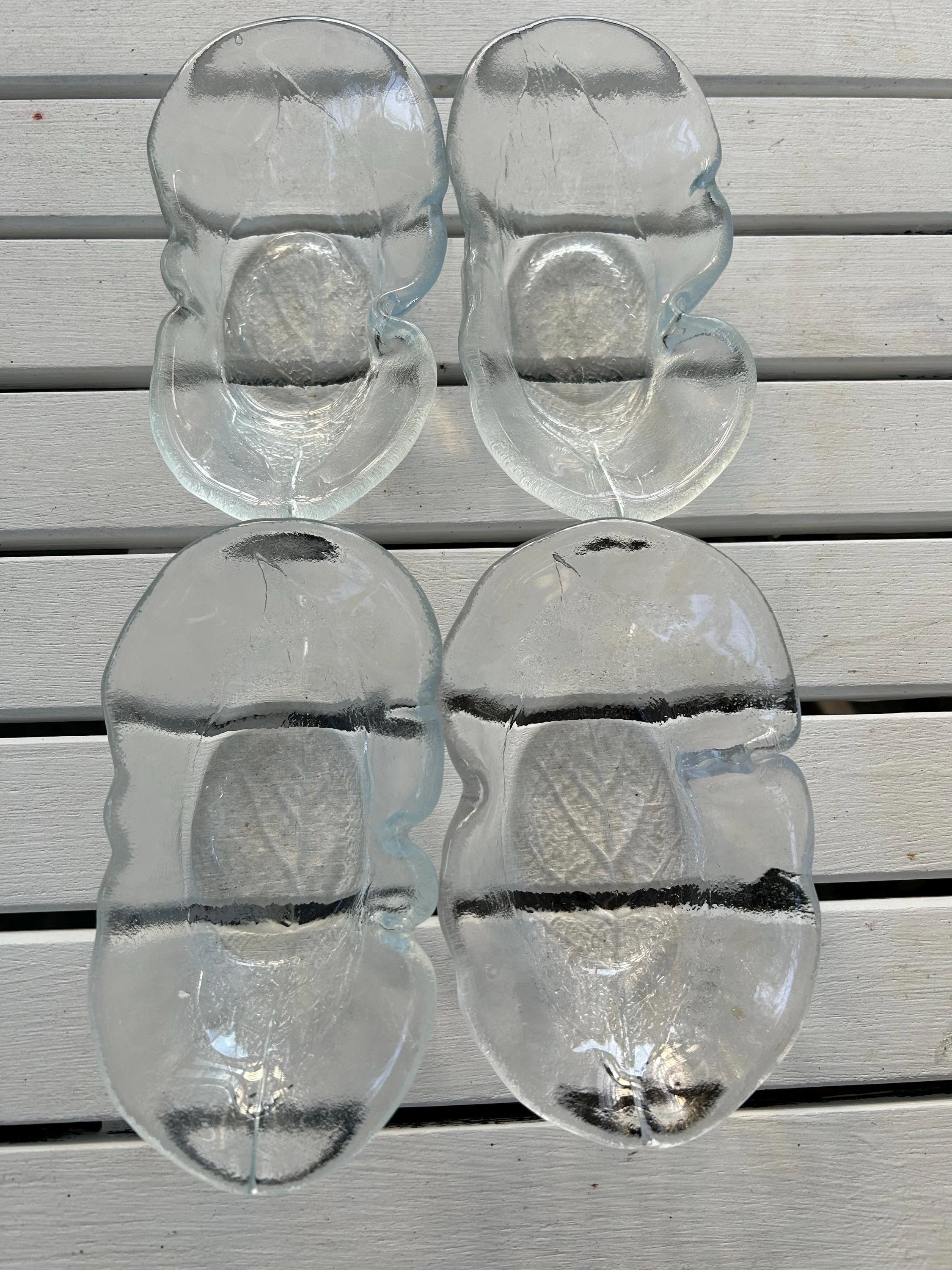 Flat lay of the set of 4 dishes on a white wooden table