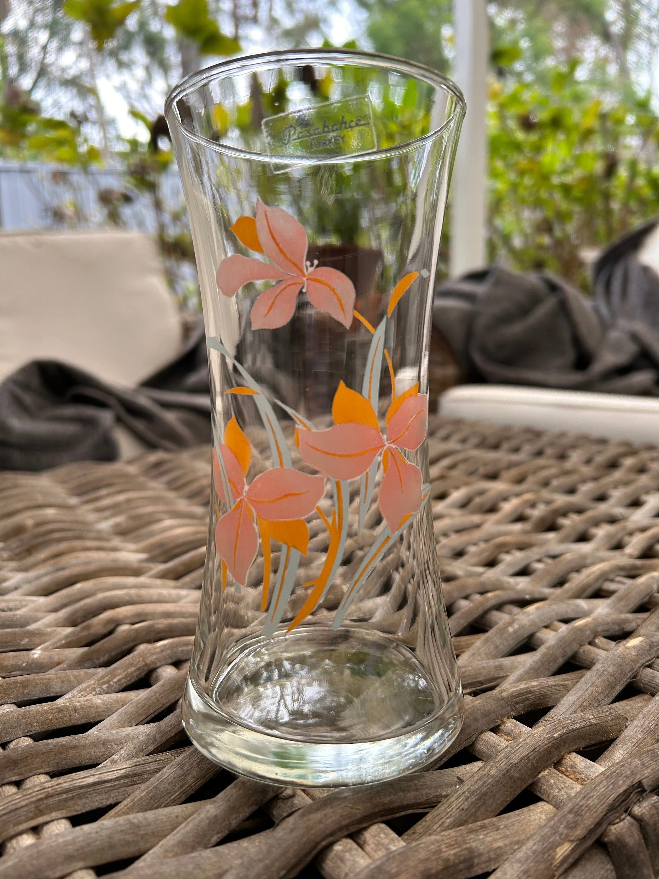 Full view of the empty vase showing painted floral design