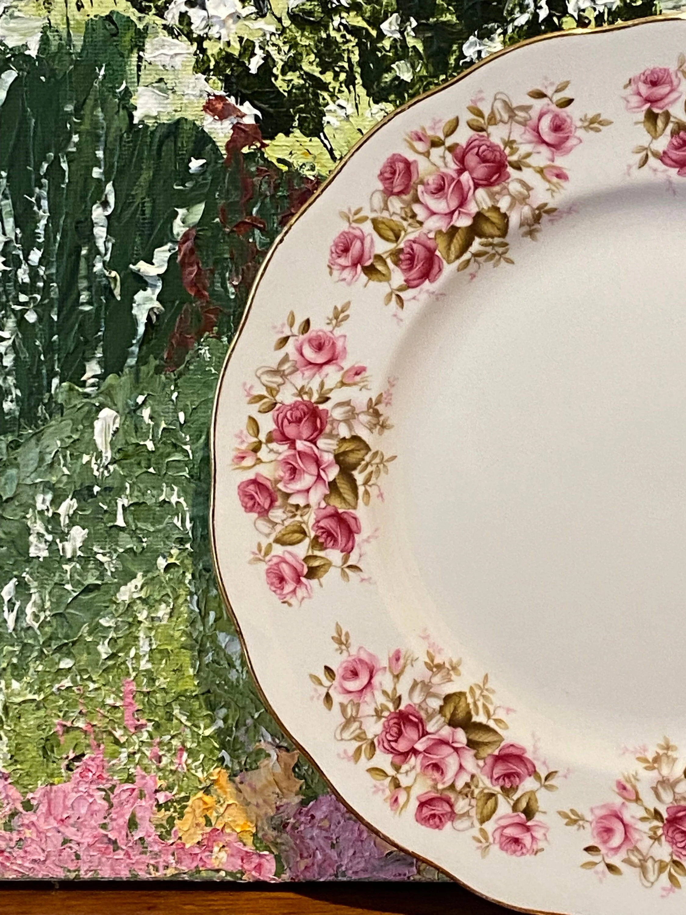 Angled side view showing pink rose pattern and scalloped edge