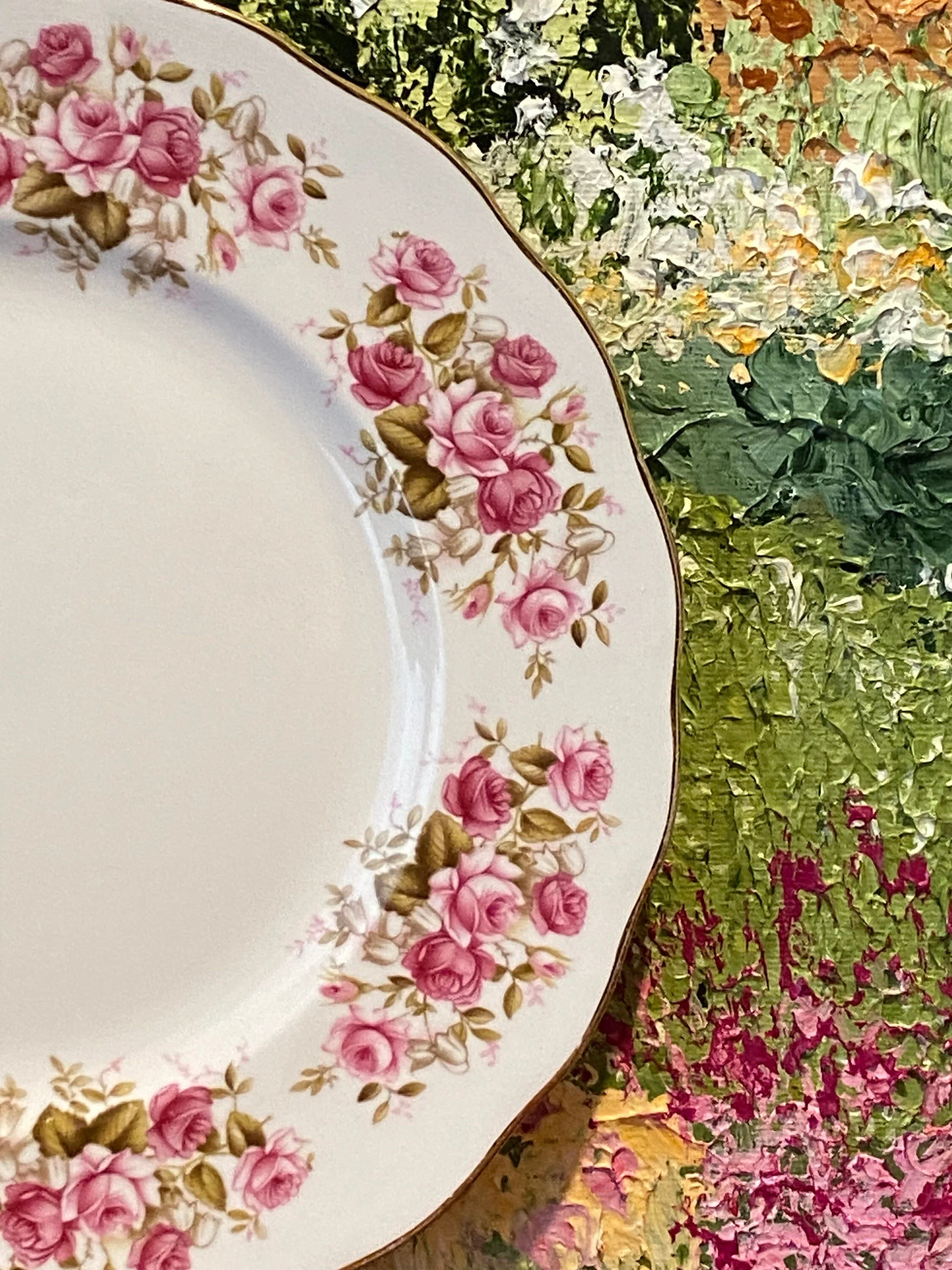 Detail view of rose clusters and gold rim