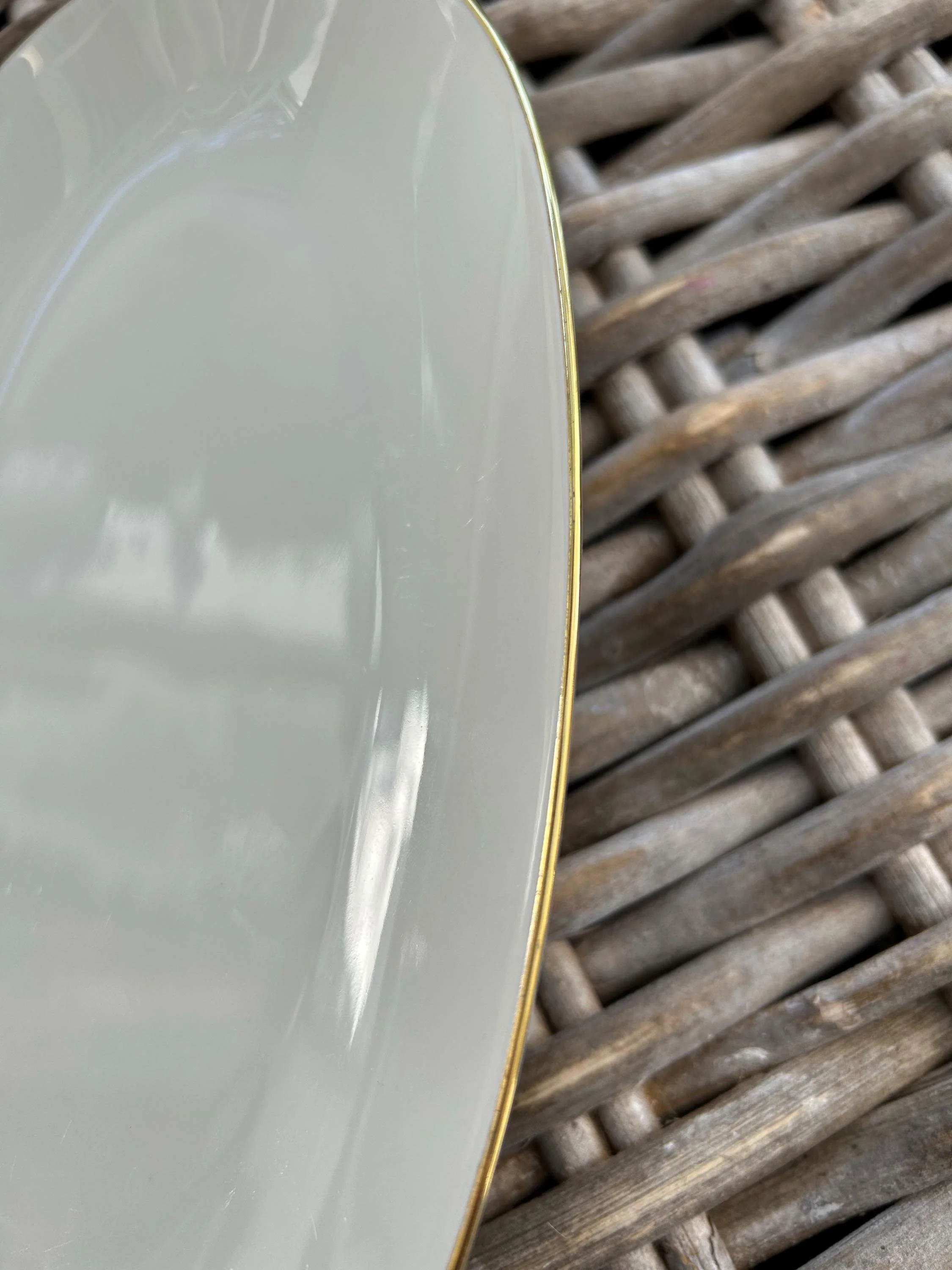 Close-up of plate surface and gold-trim detailing.