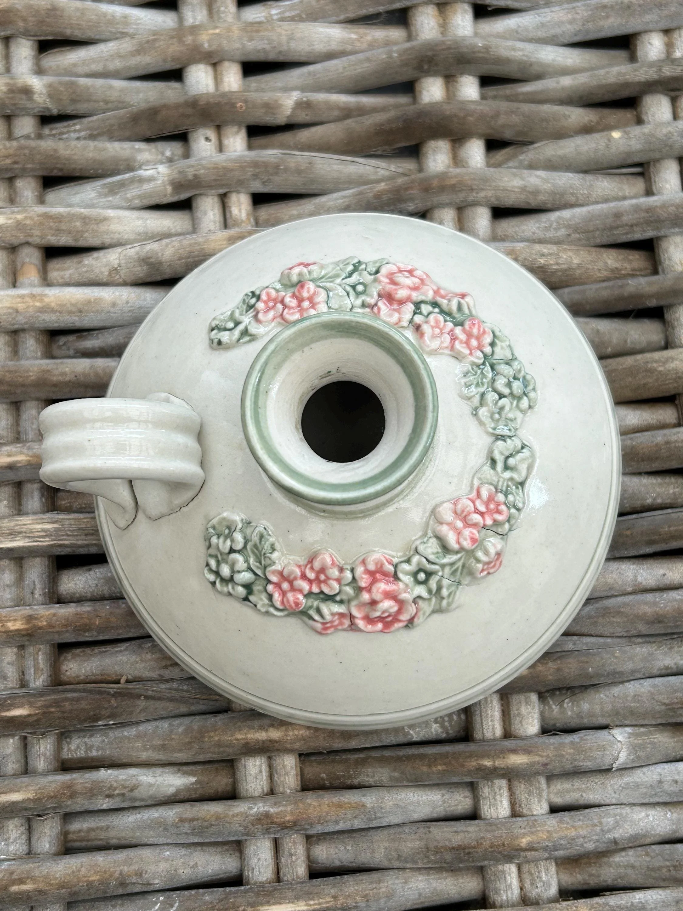 Top-down view showing circular floral arrangement and glazed finish