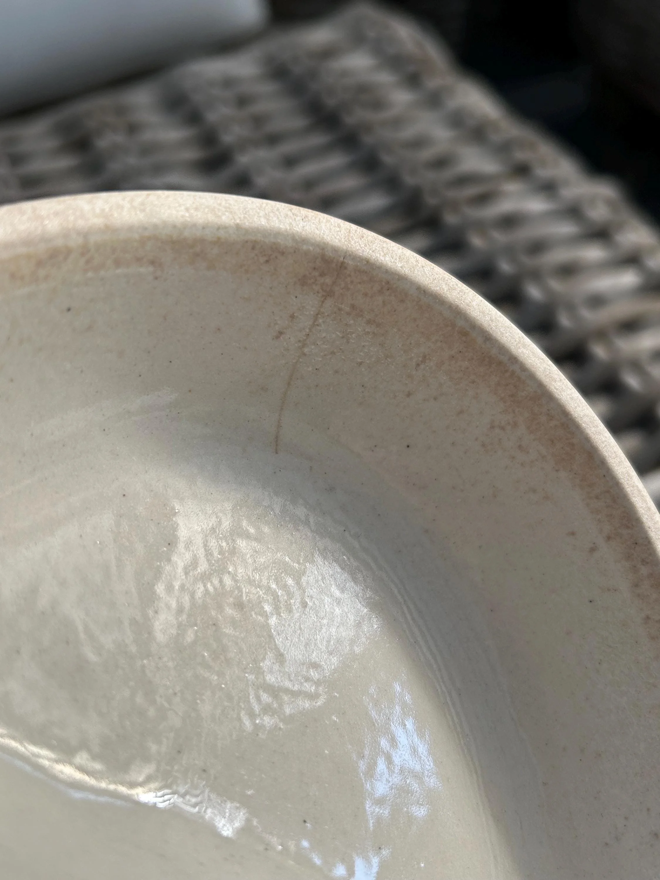 Close-up of the hairline crack under the glaze inside the lid