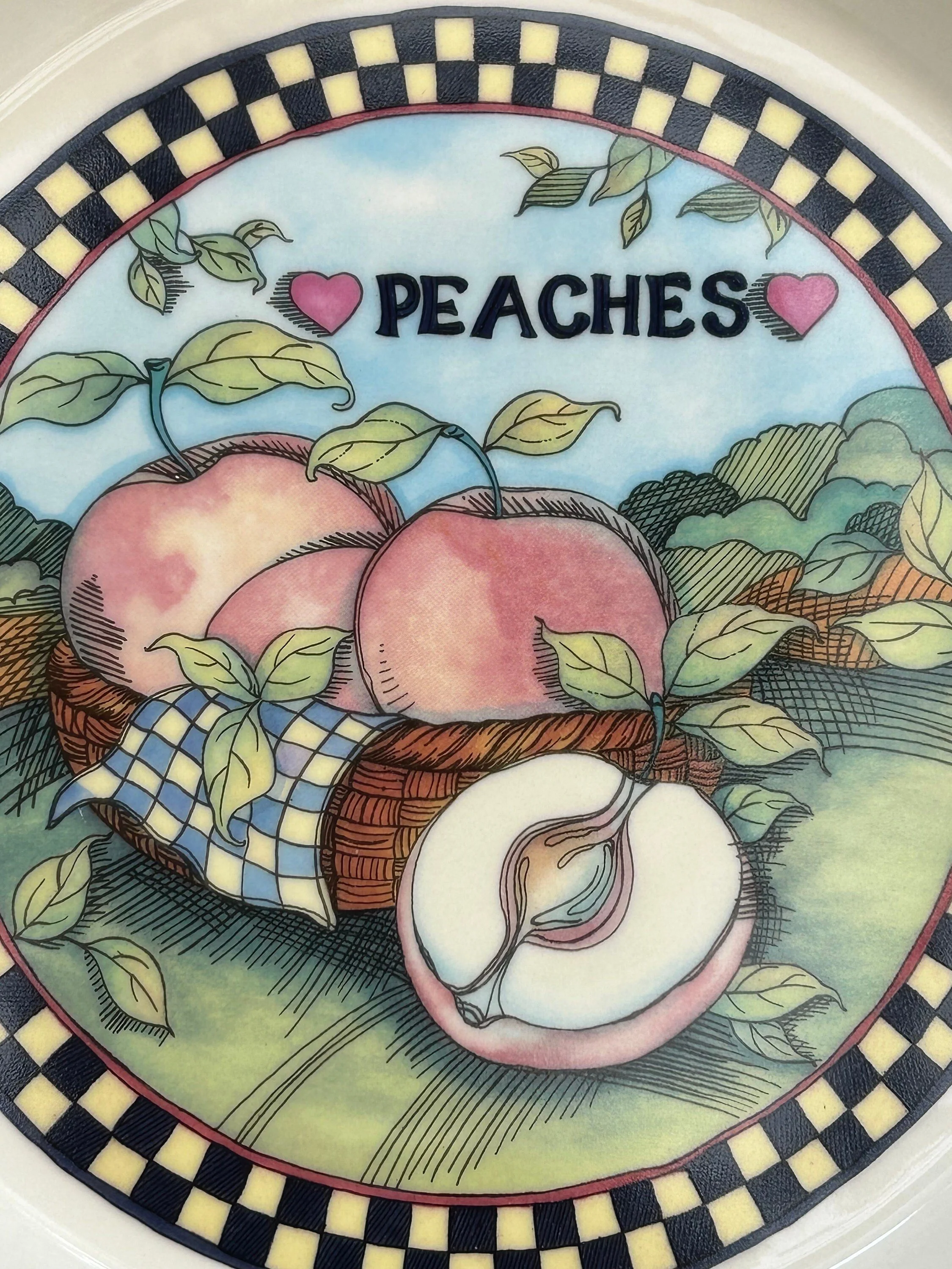Close-up of central peach illustration with basket and leaves