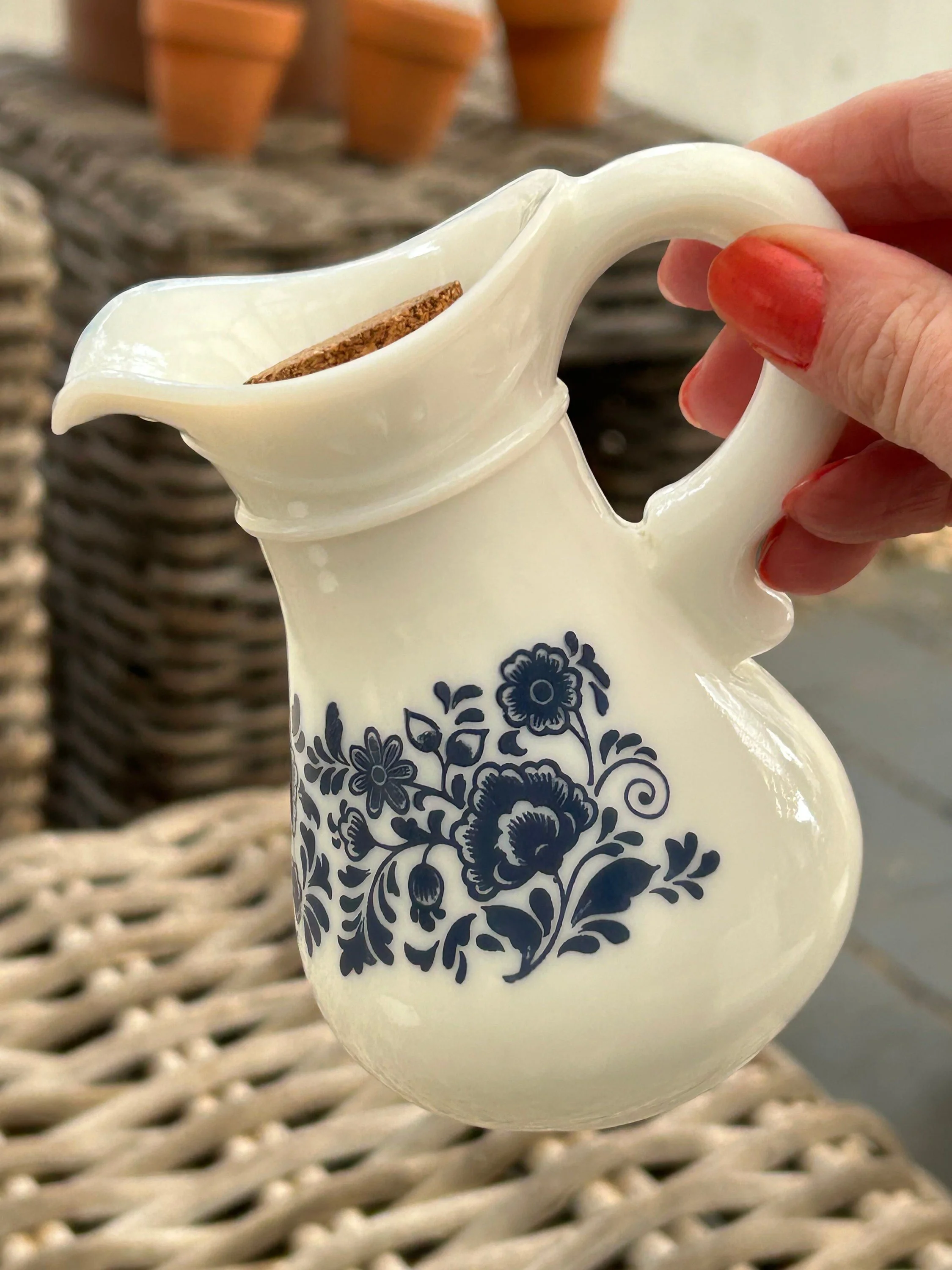 Close-up of pitcher spout with cork in place