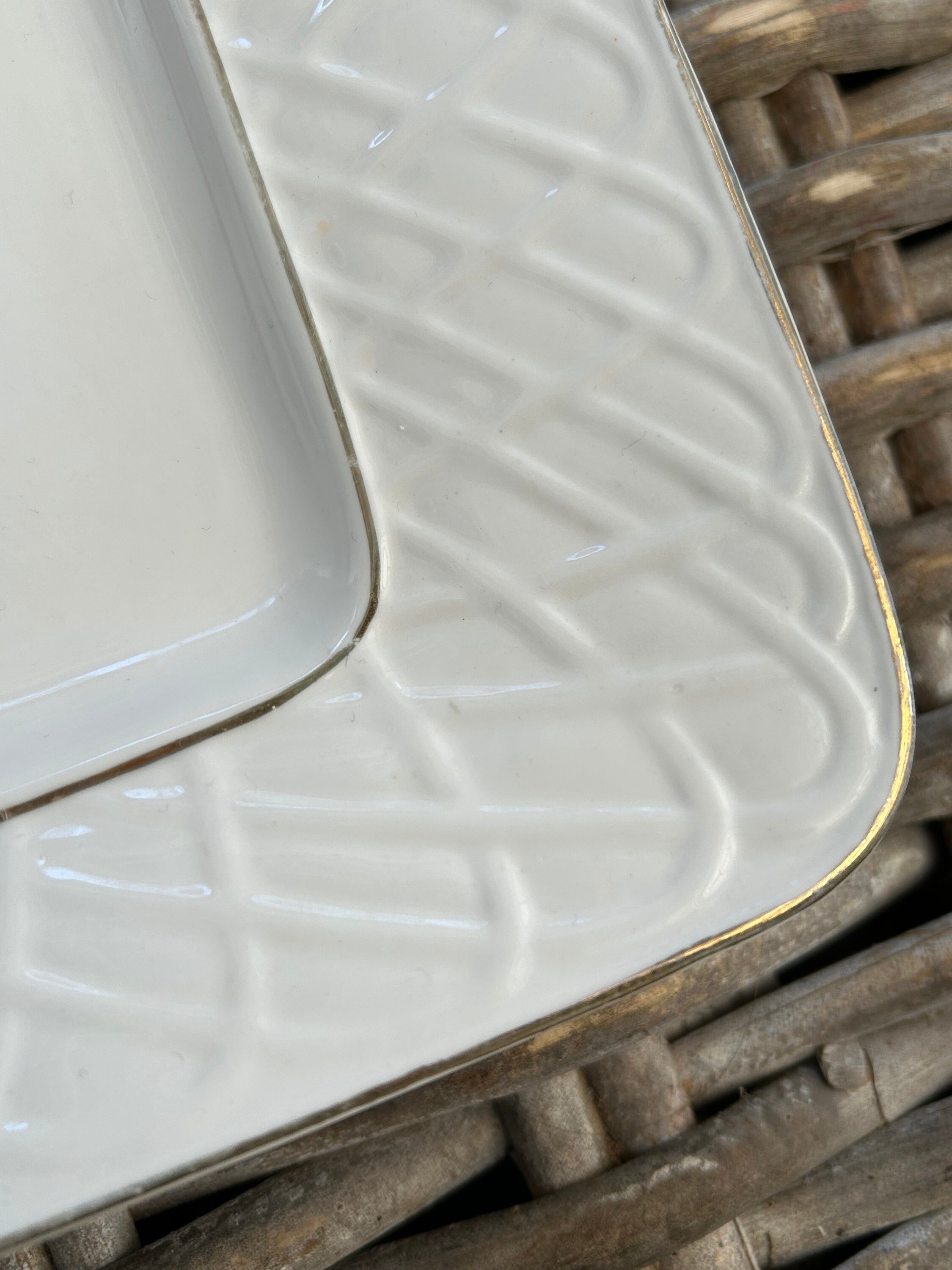 Close-up of corner edge highlighting gold trim and textured pattern