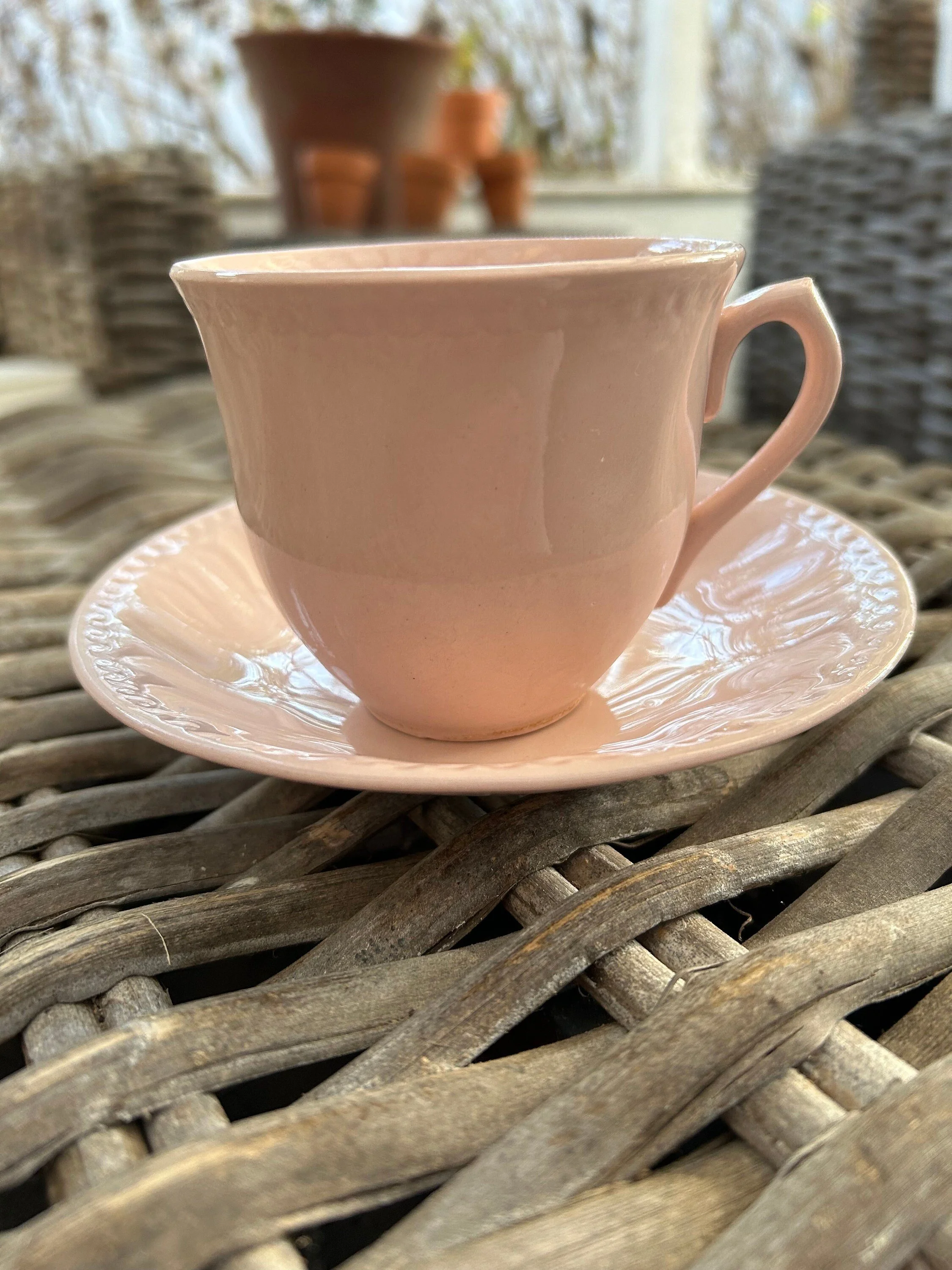 Side profile close-up of a single cup on its saucer