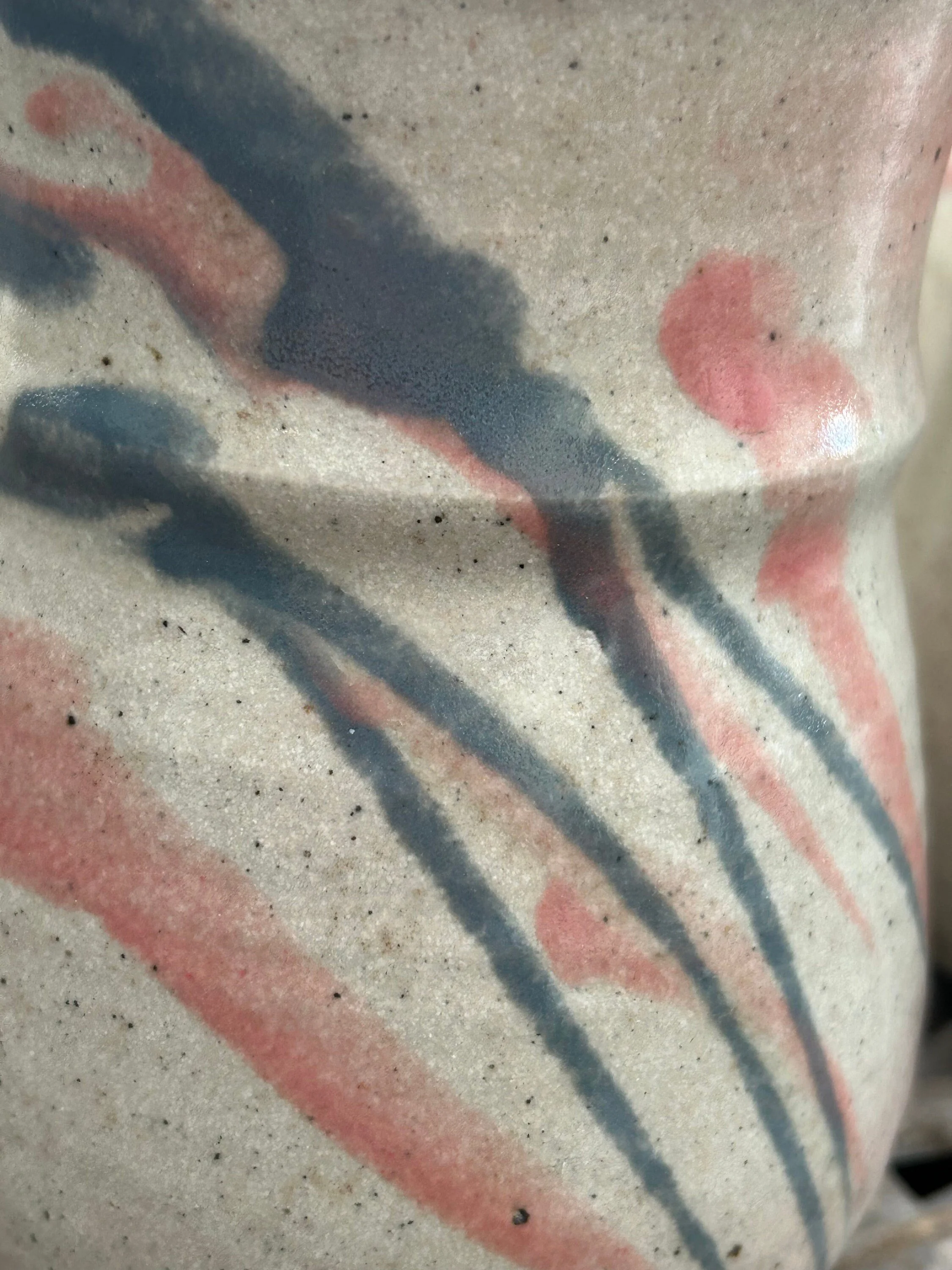 Close-up of brushstroke detail – indigo, blush, and charcoal lines