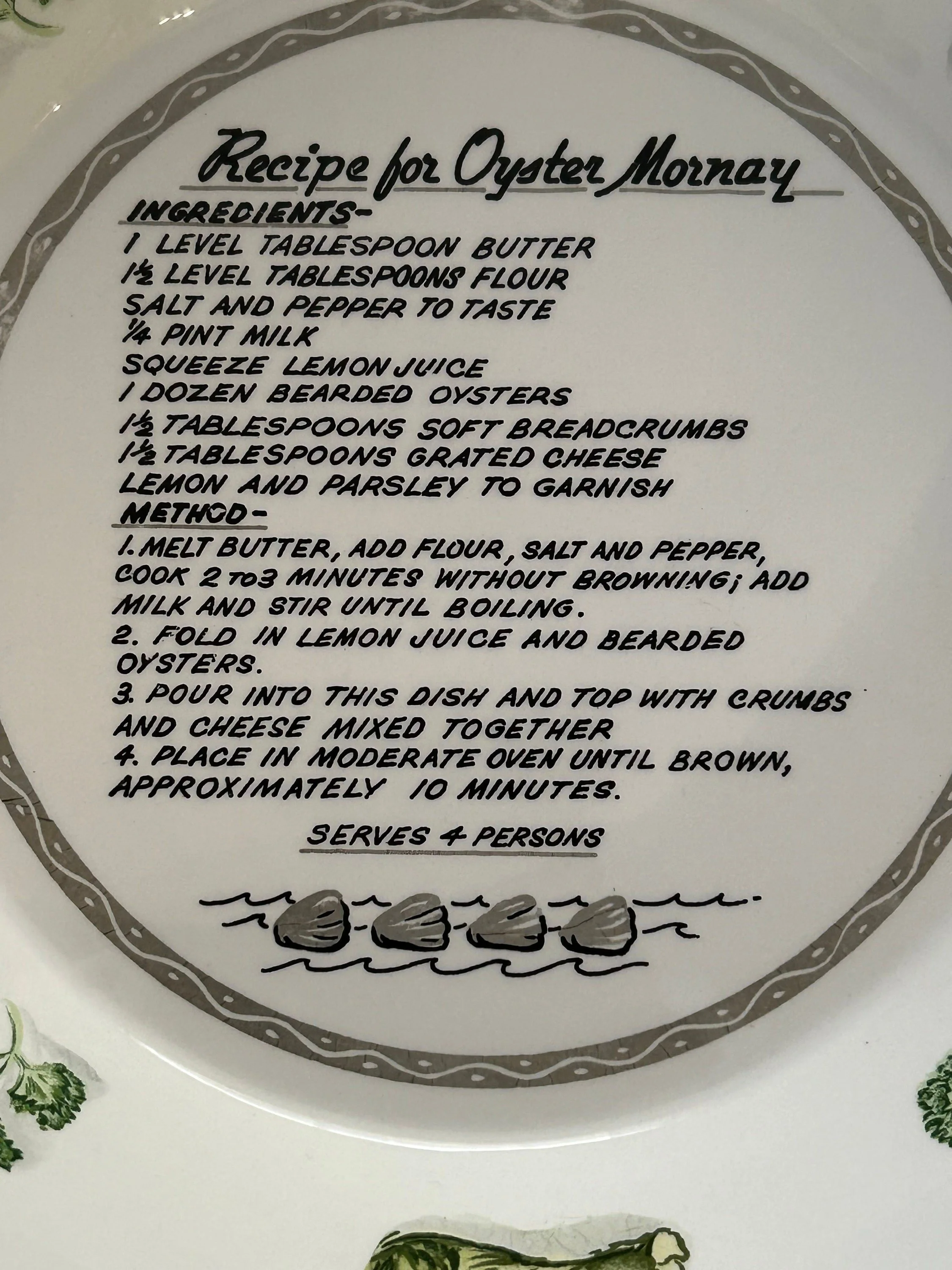 Close-up of printed Oyster Mornay recipe with clear text and shell border