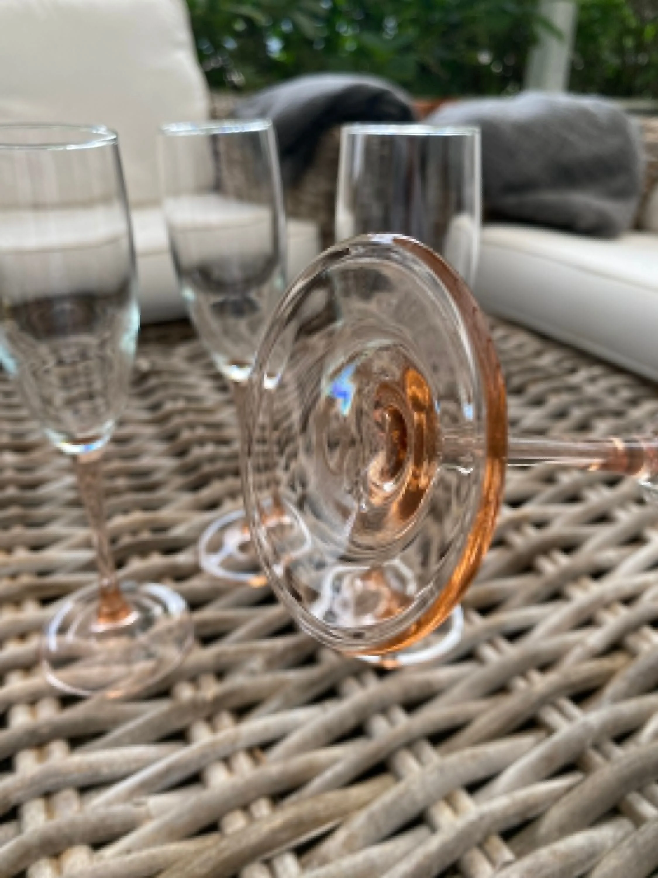 Close-up of flute base showing soft peach-pink stem detail