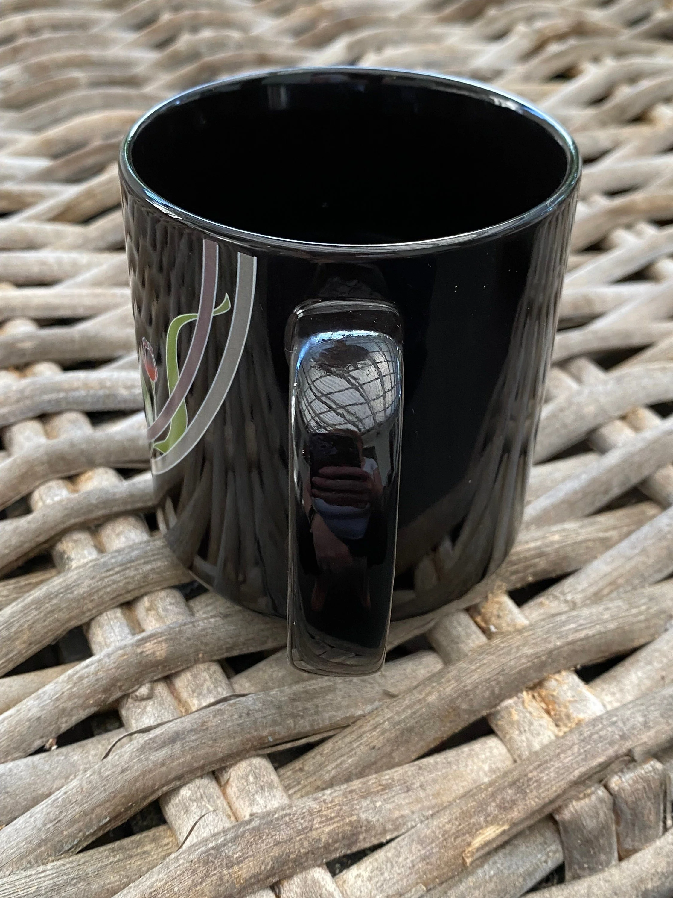 Rear view showing handle and partial floral design